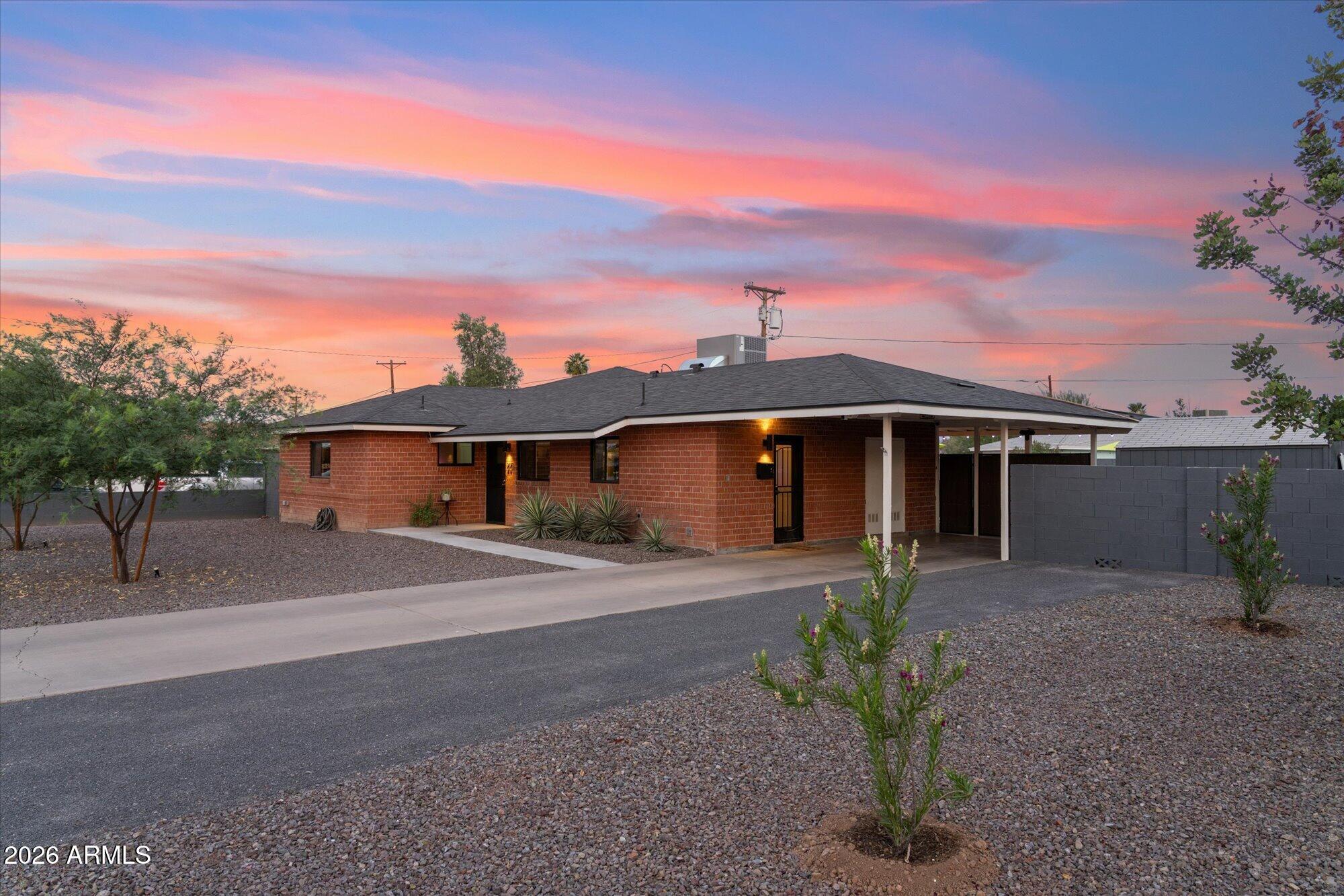 Completely reimagined and meticulously renovated, this iconic Womack-built Mid-Century Modern residence seamlessly blends timeless architecture with today's most sought-after upgrades. Thoughtfully transformed from top to bottom, improvements include a new roof, new HVAC system, new windows, designer flooring, a beautifully redesigned kitchen, updated baths, and curated finishes throughout. The open-concept layout creates an inviting atmosphere that perfectly balances warmth, style, and sophistication. Step outside your private backyard retreat featuring a sparkling pool, RV gate access, and enhanced privacy. Ideally located in the heart of the city, this home offers the opportunity to own a piece of Phoenix history while enjoying modern luxury and refined Mid-Century Modern living.