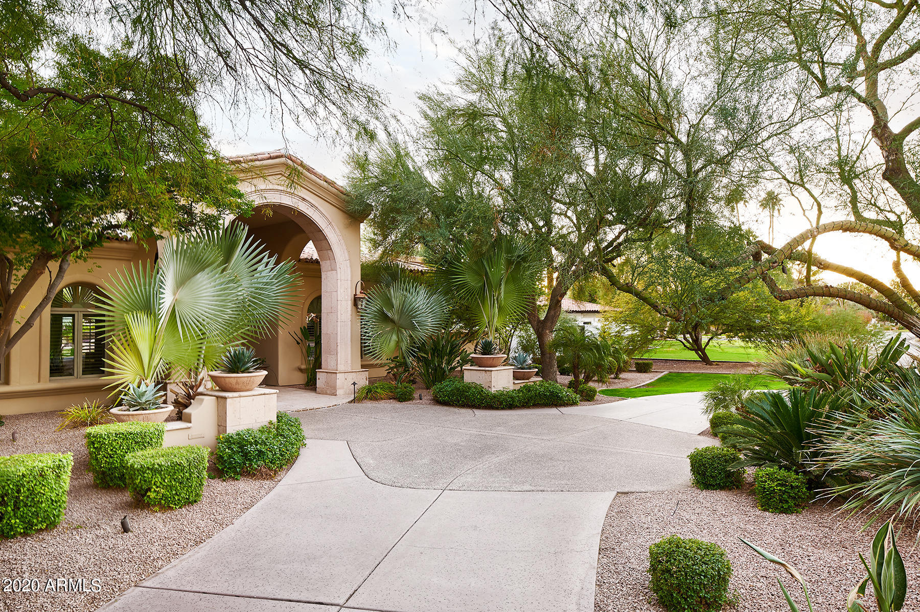 PERFECT PV ESCAPE located near Camelback Country Club with gorgeous views of Mummy MTN. Offering extremely rare amenities such as a fully finished 1,200 SQFT Basement/Game room with attached Exercise room and extra storage, a separate & cleverly hidden temp. controlled underground Wine Cellar, an eat-in true Chef's kitchen with a Butler's pantry, a walk-in Pantry, and a fully equipped walk behind Bar open to the Great room with a wall of glass that opens to massive covered patios with a built-in gas fireplace looking out to the sea of grass, a custom pool with waterslide & waterfall, Sport Court, a separate heated Spa & Firepit, and topped off with the detached 600 SQFT Guest Casita with living room, kitchen, & en suite bedroom with walk-in closet.  WELCOME TO YOUR VERY OWN 5-STAR RESORT The kitchen includes 2 dishwashers. One of the Master Closets has a 2nd Washer and Dryer - which is also included.