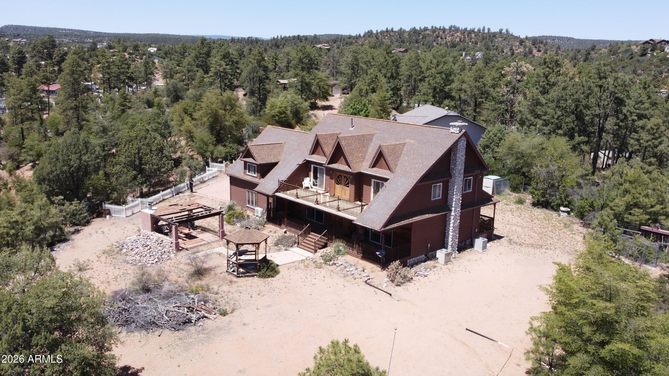 Escape to the cool pines of Payson with this charming property nestled in a peaceful setting just minutes from town. Situated on a spacious lot, this home offers the perfect blend of privacy, natural beauty, and convenience. Enjoy breathtaking Arizona skies, fresh mountain air, and room to relax or entertain. Whether you're looking for a full-time residence, weekend getaway, or investment opportunity, this property provides the ideal backdrop for enjoying all that Rim Country has to offer. Conveniently located near shopping, dining, outdoor recreation, hiking trails, lakes, and the Tonto National Forest.