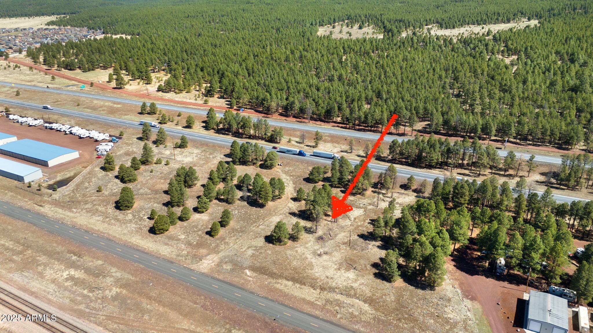3.67 Acre CH-10,000 with WATER! Seize the opportunity to own two adjacent parcels totaling 3.67 acres in beautiful Bellemont with highway access nearby. Accessible from Route 66 on the southside of I40, this level property is graced with mature ponderosa pines, which may qualify for a landscape credit when building — offering both beauty and value. A power pole is located at the rear of the property for easy access to electricity (buyer to verify). A private well has already been drilled and capped and for serious buyers, a survey, topographic survey, and soils investigation report are available saving you time and investment. Property corners are clearly marked for added peace of mind. Two Parcels are being sold together and details are for both: 11601003B (listed) & 11601003C.