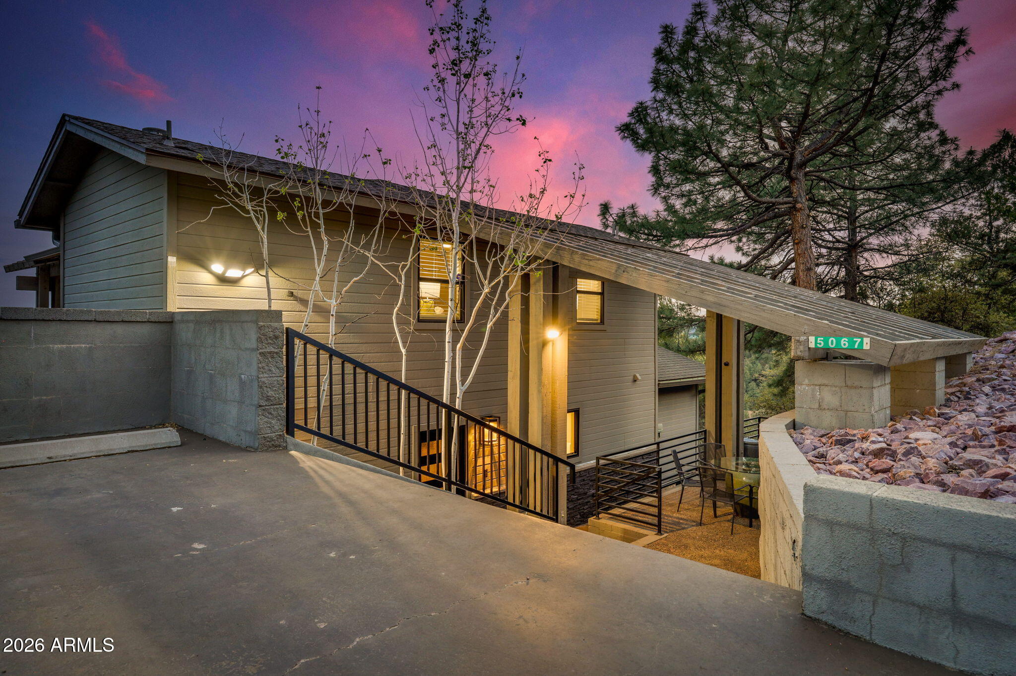 Perched above the Rim Country on nearly a full acre in Pine's coveted Portal III, this stunning hilltop retreat delivers what buyers come to Pine for - sweeping panoramic views, towering ponderosa pines, and the rare quiet that only comes from being genuinely above it all. From the moment you step through the custom steel entry door into a marble-floored foyer, it's clear this home has been transformed. The sellers have invested in an extensive renovation: refinished hardwood floors throughout the main level, all-new lighting in every room, designer Adorne outlets and plates, and every sliding door and window in the home replaced. Both bathrooms have been fully gutted and rebuilt, and the remodeled kitchen flows into the great room, where the views frame themselves like artwork through the glass.

Step outside to the rebuilt upper and lower Trex decks - the crown feature of this home - where the elevation and nearly one-acre lot deliver unobstructed views of the Mogollon Rim, the valley below, and the tree canopy in every direction. New gutters, new deck railings, and new exterior lighting round out an exterior that's genuinely maintenance-ready.

Downstairs, the pool room adds a dimension most Rim Country properties simply don't offer - floated walls, all-new lighting, a new closet, and glass doors make this a true bonus living space, not an afterthought.

Located minutes from Pine's restaurants, hiking trails, and community events, and an easy drive to Payson and the Valley, this property offers everything that makes Rim Country living extraordinary - without the to-do list that usually comes with it.