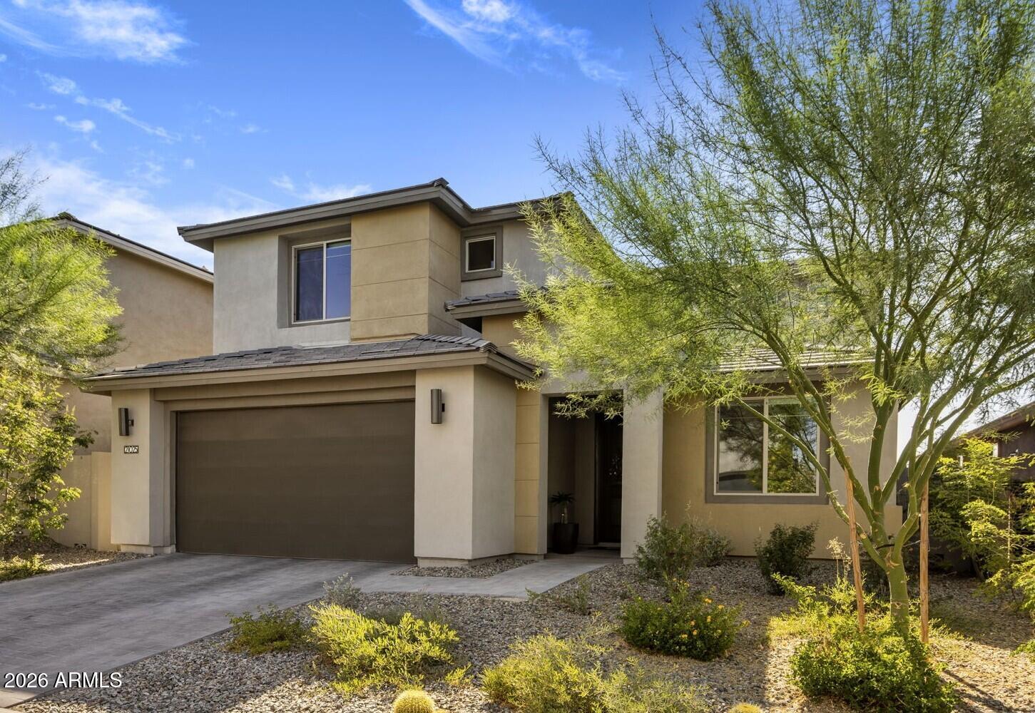 Wake up to stunning mountain views in this nearly new home in the gated community of Talinn in Desert Ridge. Set on a premium cul-de-sac lot, this thoughtfully designed home offers the perfect blend of modern design, flexible living & one of North Phoenix's most desirable lifestyles. The popular Prato plan features nearly 3000sf with 5 bedrooms, 4 bathrooms, a versatile loft & an oversized 2.5-car garage with an EV charger & ample storage.

Enjoy the convenience of a private first-floor primary suite featuring dual sinks, a beautifully tiled shower and a spacious walk-in closet. A second downstairs bedroom and full bath offer exceptional flexibility for guests, multigenerational living, or a home office.

The well-appointed kitchen features quartz countertops, a gas cooktop, abundant cabinets, and an oversized island overlooking the dramatic two-story great room with built-in surround sound.

Step through the large sliding glass doors to your private backyard, where stunning mountain views create the perfect setting for morning coffee, evening sunsets, and outdoor relaxation. Located on a premium cul-de-sac lot with no through traffic, this home offers privacy and tranquility.

Talinn offers one of Desert Ridge's most desirable gated community lifestyles with a clubhouse, swimming pool, and convenient access to Loop 101 and SR 51. Everyday conveniences are just minutes away with Sprouts Farmers Market and Trader Joe's coming soon nearby, while shopping, dining, and entertainment options abound at Desert Ridge Marketplace, CityNorth, Kierland Commons, and Scottsdale Quarter.