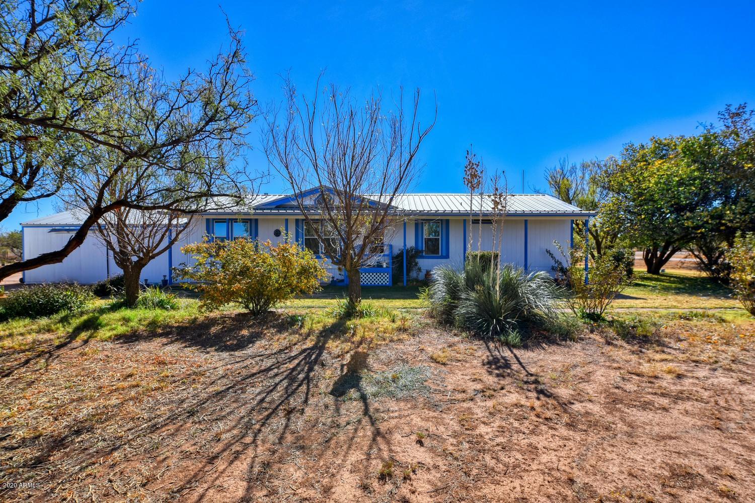 Country living at it's finest!! Welcome to your new 3 bedroom 2 bathroom home. Inside this home you will find laminate flooring and carpet. Newer kitchen cabinets and newer laminate counter tops. Newer recessed lighting through out the kitchen. Laundry room with an exterior door is off of the kitchen. Also off of the kitchen will be your eating area. Plenty of room for a large or small table.  Off of the eating area you will enter into your family room. From there you will have two bedrooms and a bathroom. The master bedroom and master bathroom are located on the other side of the home. Home is cooled and heated with an installed mini split with programable thermostat. Home can also be heated with a propane furnace. Current owners have only used the mini split as their source of cooling and heating. Outside you will find that your home sits on 4.8 acres. A storage shed on the southside of the home. Back yard is fenced in for your pets. 90% of the property is fenced in. Patio coverings on the front and back of the home as well. To the east side of the property you will find over 1000  stocks of blackberries plants. This home is a gem and will not last long, call me today for a private showing. ****DISCLOSURE**** THE SHED THAT IS LOACTED TO THE EAST OF THE HOME DOES NOT CONVEY WITH THE SALE OF THE HOME. THAT SHED IS PART OF A BUSINESS AND WILL BE REMOVED FROM THE PROPERTY PRIOR TO THE CLOSE OF ESCROW.