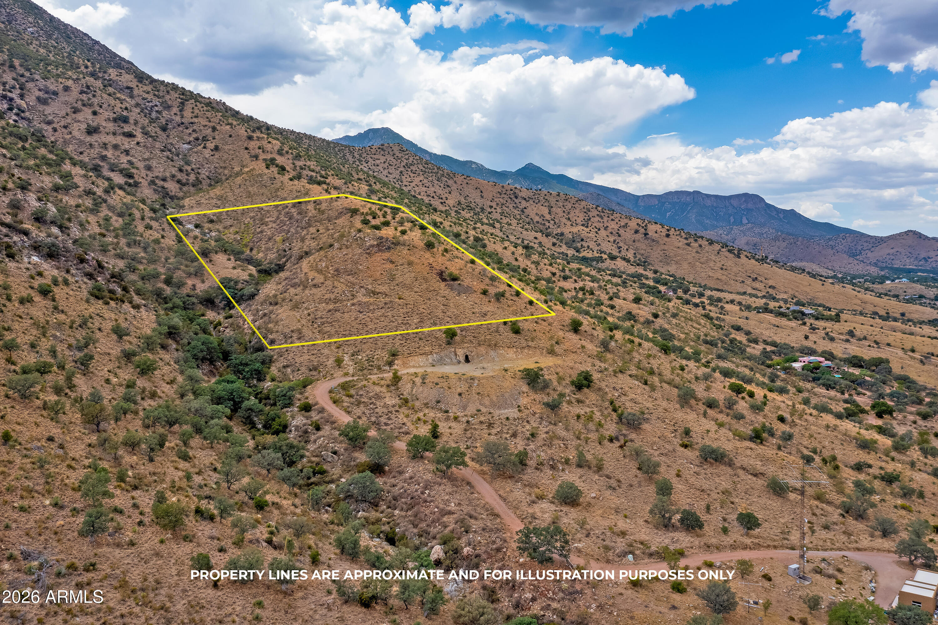 Lower 5 acres. Surrounded by national forest in the Huachuca Mountains; great hiking, camping and hunting; abundant wildlife; beautiful building site with awesome views, power and water; excellent access, just one mile off highway 92. Short distance to Ramsey Canyon, Coronado National Park, and Our Lady of the Sierras Shrine and Chapel. Easy drive to Bisbee, Tombstone and Sierra Vista. Tucson Airport just over one hour. Elevation 5, 230' for ideal climate. Owner will carry with 25% down.