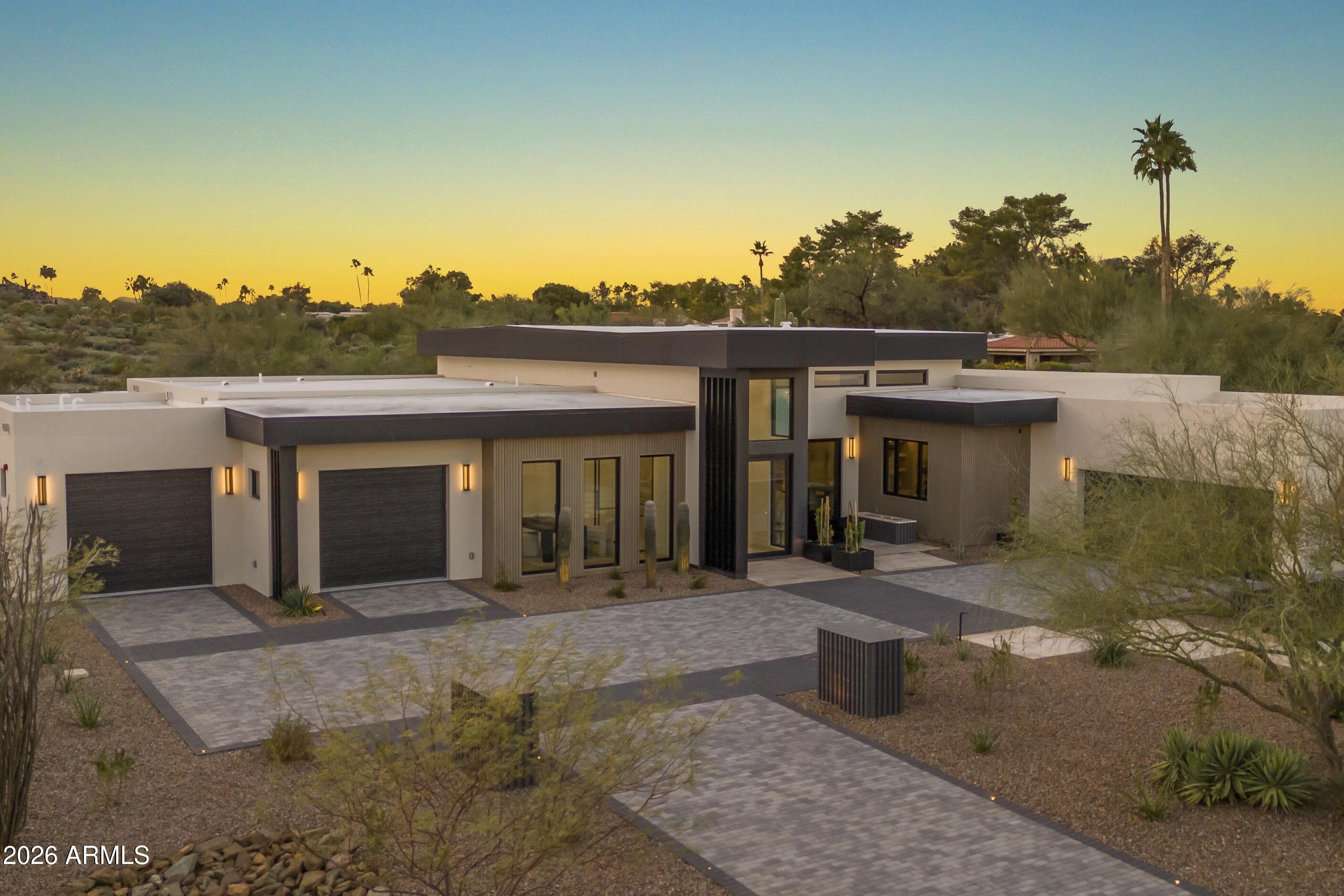 Nestled against the Phoenix Mountain Preserve, this exceptional new construction residence offers a rare blend of refined design and direct access to nature. Step out your back door and onto miles of scenic hiking and mountain biking trails, creating a seamless indoor-outdoor lifestyle. Inside, high-end designer finishes elevate every space, complemented by a premium Sub-Zero/Wolf appliance package anchoring the main kitchen. A fully functioning back kitchen—complete with refrigerator, oven, speed oven, and dishwasher—adds both convenience and discretion for entertaining. The thoughtfully designed floor plan features two expansive primary suites, ideal for multi-generational living or hosting guests, along with two additional ensuite bedrooms.  A 4 car garage completes this new home.