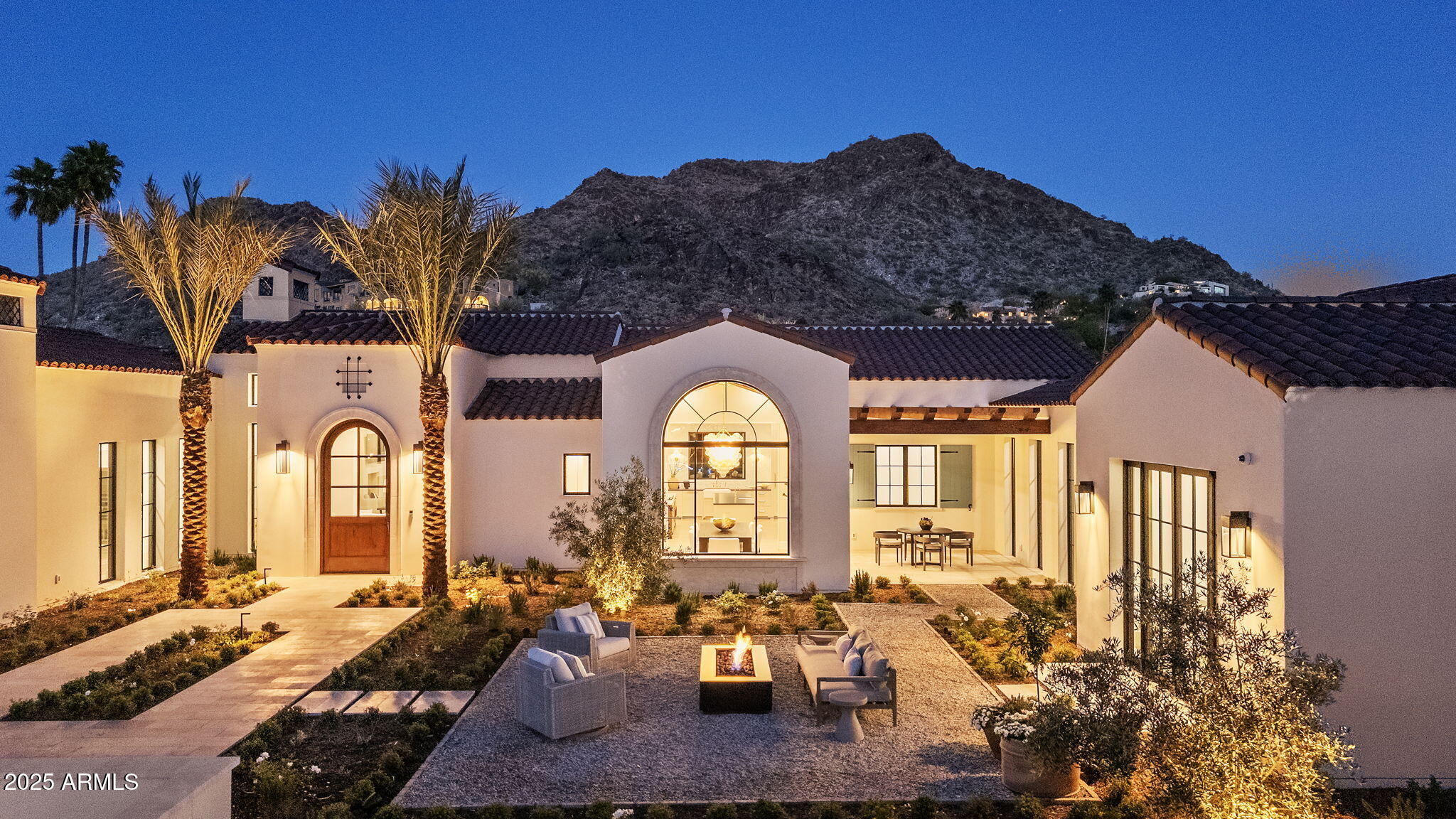 Brand new custom home on the 4th fairway of the PVCC golf course with unobstructed Mummy Mountain views.  This is the ultimate indoor/ outdoor living experience.  This is a once-in-a-generation estate custom built in 2025 by Paramount Luxury Development and Sapanaro Development. This Santa Barbara-inspired masterpiece blends breathtaking architecture with Arizona's natural beauty. Step inside to soaring ceilings, walls of glass, a dual-island kitchen, incredible back kitchen, huge secondary bedrooms, a separate family and tv space and the perfect guest casita, all meticulously designed to create a life of effortless luxury. The private owner's wing offers the very best sunrise mountain views, indoor and outdoor showers, a copper soaking tub, two closets & separate lounge/ reading area. Outside, a resort-style pool with spa are surrounded by lush grounds that provide the perfect setting for entertaining. A true masterpiece on the most incredible lot ever to come available in Paradise Valley!