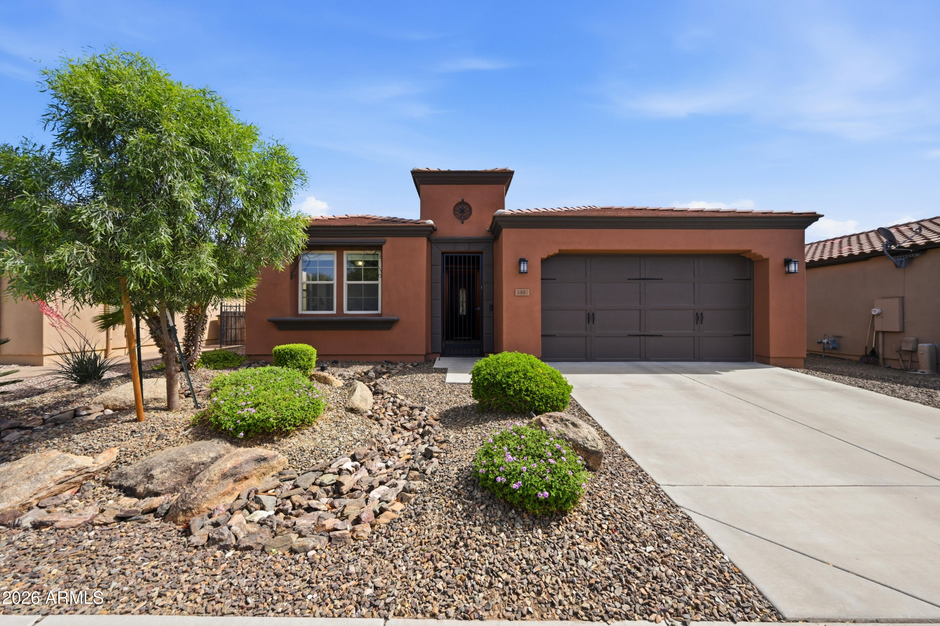 Rare Cannes model in Encanterra which features seamless indoor/outdoor living with a rolling wall of glass opening to an extended paver patio and beautifully landscaped backyard with turf and accent lighting great for entertaining.  This popular split floorplan includes 3 full bedrooms and an oversized laundry/hobby room with abundant cabinetry for storage.  The kitchen features tall walnut cabinetry, granite countertops with full backsplash, gas stove.   Major system updates include a new 5-ton Trane HVAC system, exterior paint, water softener, RO system and updated drip irrigation.  Located in award winning gated Encanterra community with golf, pickleball, tennis, resort pools, fitness center, spa and endless social amenities.  Located in phase 1 with mature landscaping on quiet street.