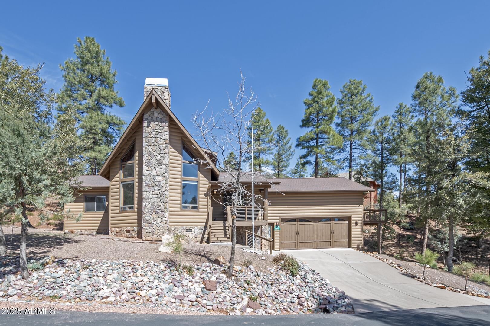 Nestled in the picturesque subdivision of Strawberry Hollow, this stunning log-sided home sits on three lots, totaling nearly an acre (0.98 acres) and comes fully furnished - Turn Key! Featuring rustic charm with modern amenities, this home offers a perfect blend of comfort and style.
Step inside to soaring wood cathedral ceilings in the great room, where natural light pours in, highlighting the hardwood floors and a cozy gas fireplace--convertible to wood-burning. The open-concept kitchen boasts stainless steel appliances, granite countertops, and a travertine backsplash, ideal for cooking and entertaining.
The main level features two spacious ensuite bedrooms, one of which includes a jetted tub, double sinks, and a linen cabinet for added convenience. Upstairs, a large loft overlooks t