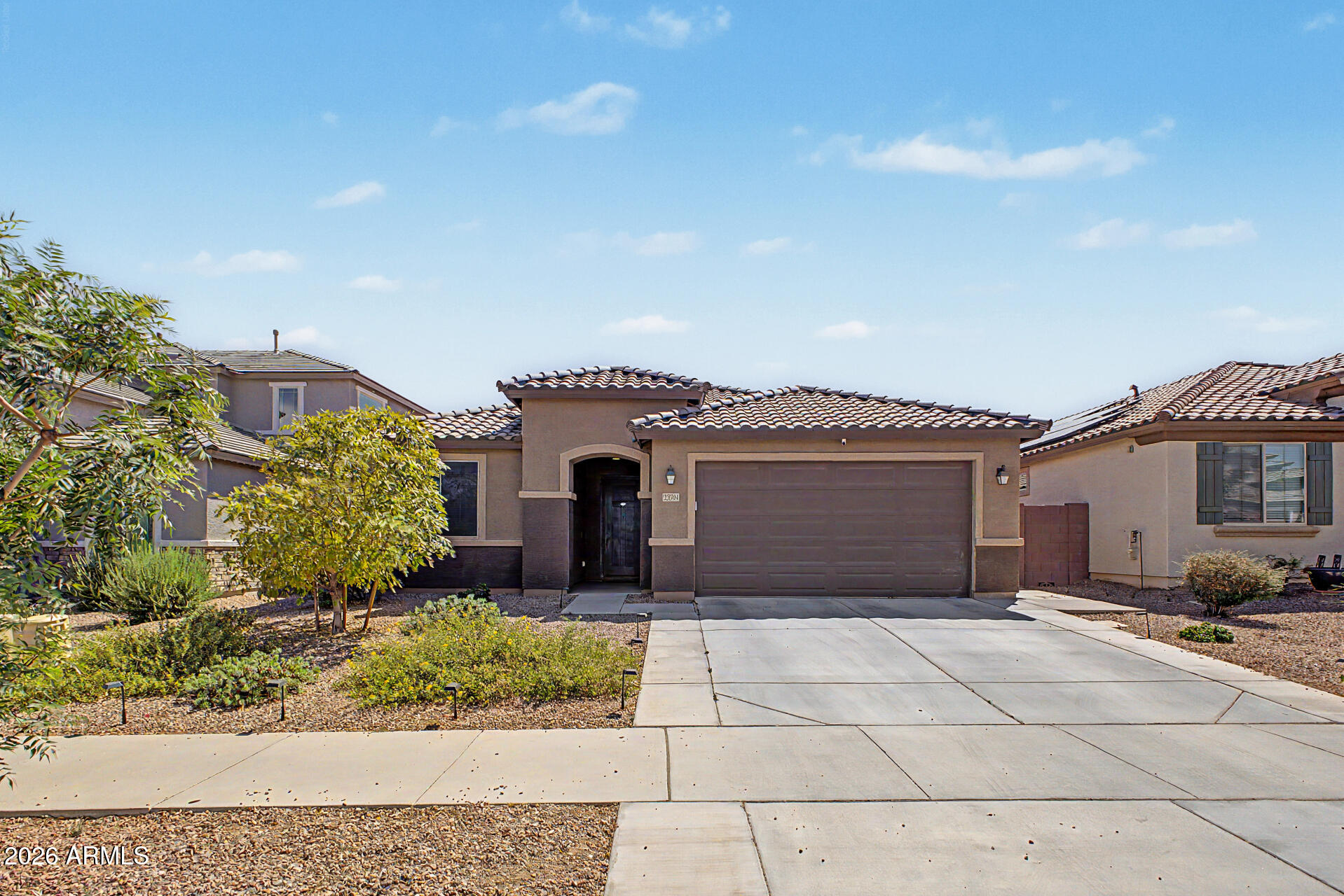 Welcome to this charming home in Desert Oasis! Providing 3 beds, 2 baths, 2-car garage, & mature landscape. The inviting interior showcases tons of natural light, tall ceilings, a designer palette, tile flooring in common areas, and soft carpet in bedrooms. You'll love the seamlessly flowing open layout, making entertaining a bliss! The spotless kitchen boasts SS appliances, quartz counters, a pantry, subway tile backsplash, recessed & pendant lighting, shaker cabinetry w/crown molding, and an island w/breakfast bar. Versatile den for an office! Large main bedroom has a barn door that opens to the ensuite, featuring dual sinks, walk-in closet, & a tiled shower w/dry-off area. Outback, you have artificial turf, covered patio, and an additional open seating area. Near US-60! Make this yours!