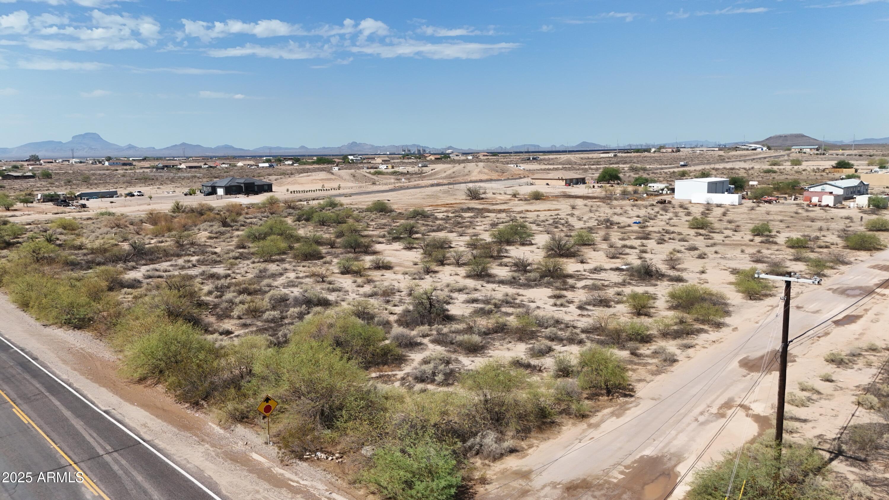 Discover the perfect canvas for your dream property on this expansive 2.6-acre corner lot! Nestled in a peaceful setting with fantastic mountain views, this prime piece of land offers endless possibilities. Enjoy the convenience of paved roads and close proximity to Arlington Elementary School, just minutes away. With plenty of space for horses, trucks, RVs, and all your toys, this property is ideal for those seeking both tranquility and freedom. Whether you're planning to create a custom home, a hobby farm, or a private retreat, this versatile lot is a rare find! Don't miss this excellent opportunity!