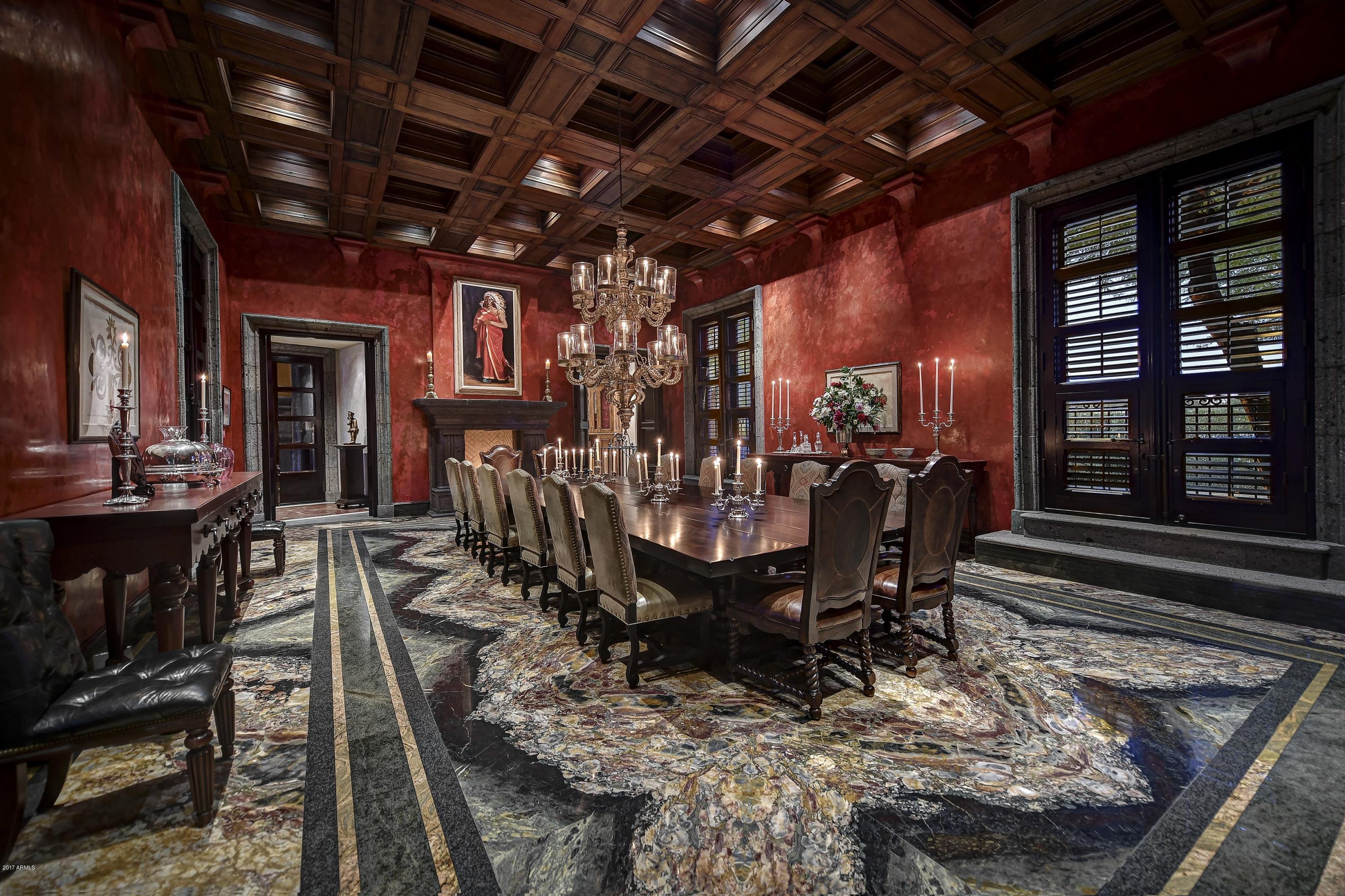 Romantic Urban Villa in the heart of Paradise Valley. This palatial Mediterranean estate is a master class in what can be achieved with the worlds finest materials, a renowned team of artisans, and an unlimited budget.
Designed by Juan Sandoval following the format of 17th Century Colonial architecture, but with every modern convenience. This magnificent home is unparalleled in its construction quality and architectural precision. Every 2 acre part of this estate was designed and built in over a ten year period. Two spectacular central courtyards. One for gardens and fountains, the other for a stunning 60X60 foot pool. The design of the home guarantees beauty from every room, and a level of security unmatched by even the most advanced technology. DO NOT MISS MOTION VIDEO To pass through the gates is to be transported to another place in time.

Exterior improvements:

Brick paver driveway,
13' custom entry door of Honduran Mahogany,
9 fountains, professional landscaping,
Approximately 6,800 sf of courtyard patios with evaporative cooling and tile decking,
Gas light sconces,
6 car main garage with custom doors and additional 2 car garage,
Solid Stone Canterra accents,
Mosaic tile 3,500+- sf pool with separate spa,
Canterra columns, observation deck, custom wrought iron railings/accents
Outdoor kitchen with dual Viking BBQ's with fan-hood, Miele dishwasher, Sub-Zero refrigerator,
Interior improvements:
All interior walls are either Venetian plaster, marble or granite from floor to ceiling. All ceilings are either wood, marble or granite.
There is no exposed drywall.
Interior doors are either 8', 10' or 12' foot steel with 3 inch Mahogany encased
All flooring is stone and many are granite slab,
Custom wood coffered ceilings,
13 fireplaces with Canterra Stone fronts/hearth and mantles,
Lutron home automation,
All ironwork was custom built on-site,
All under cabinet kick plates are stone,
All heating/cooling ventilation is hidden behind crown molding with no exposed vents,
Game room with walk-in bar with hand carved wood counter and custom cabinetry,
Bar with Canterra foot base, Sub-Zero wine chiller, additional refrigerator, ice maker and Miele dishwasher Living room with built-in bookcase, custom iron spiral stair to upper bookcase, wood paneling and ceiling Wine Cellar with 2,500 bottle capacity and tasting room
Unfinished basement with 70' long shooting range and proposed home theater
Three laundry rooms,
Custom wood shutters,
Four bedrooms with wet bars, stone counters and under counter refrigerator,
One bedroom with sleeping loft,
Upstairs recreation room with bath,
Master bedroom with double entry doors,
His bath with slab tub, radiant heated floors, steam shower with multiple heads, water closet and urinal Her bath with Multiple head shower, marble counters, water closet and bidet,
His and her walk-in closets,
Kitchen with plaster range hood, four Sub-Zero refrigerator/freezers, five Kitchen Aid dishwashers, 60" Wolf gas cooktop and additional 36" Wolf gas cooktop, granite slab counters and butlers pantry, custom cabinetry.
-17,000 SF Interior Space
-10,000 SF Arcade
-20,000 SF Courtyard
-45,000 SF Lockable Perimeter
-2,700 SF Basement consisting of 700 sqft Wine Celler plus 2,000 sqft Theater and Gaming Range
