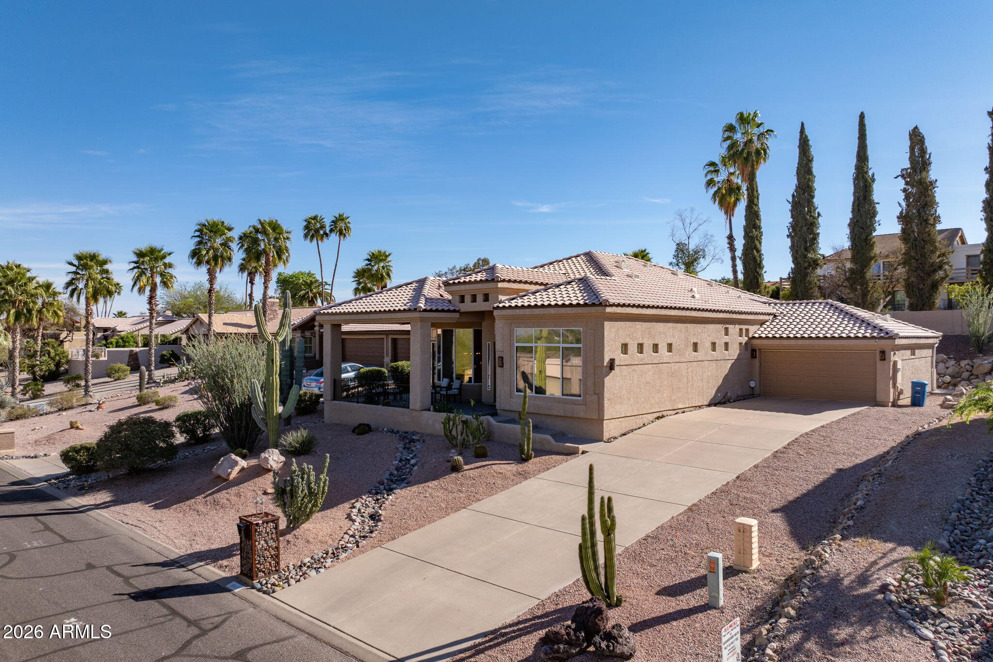 Welcome to this exceptional Fountain Hills beauty, where luxury meets convenience. Step inside and be amazed by soaring 15-foot ceilings and expansive, oversized butted windows that flood the interior with natural light and frame breathtaking views of the Four Peaks mountains. The stylish kitchen boasts quartz and granite countertops, a spacious walk-in pantry, stainless steel appliances, and a built-in desk area--perfect for everyday living and entertaining guests.
The thoughtfully split main bedroom suite features its own oversized windows with magnificent mountain vistas, dual walk-in closets, and a brand-new oversized tile shower for a spa-inspired retreat. All bedrooms and closets are enhanced with new wood-look laminate flooring for a modern touch. Outdoors, new paver extend along the entire back of the home, including the inviting covered patio, creating ideal spaces for relaxation. Enjoy the easy-care backyard, designed for minimal maintenance and maximum enjoyment. Don't forget to review the comprehensive list of recent improvements under Documents.  Note the plantation shutters - skylights in hall and middle bathroom; new roof in 2018 and one new a/c unit in 2019.  NO HOA - Located close to the world famous Fountain Park and all that Fountain Hills has to offer.