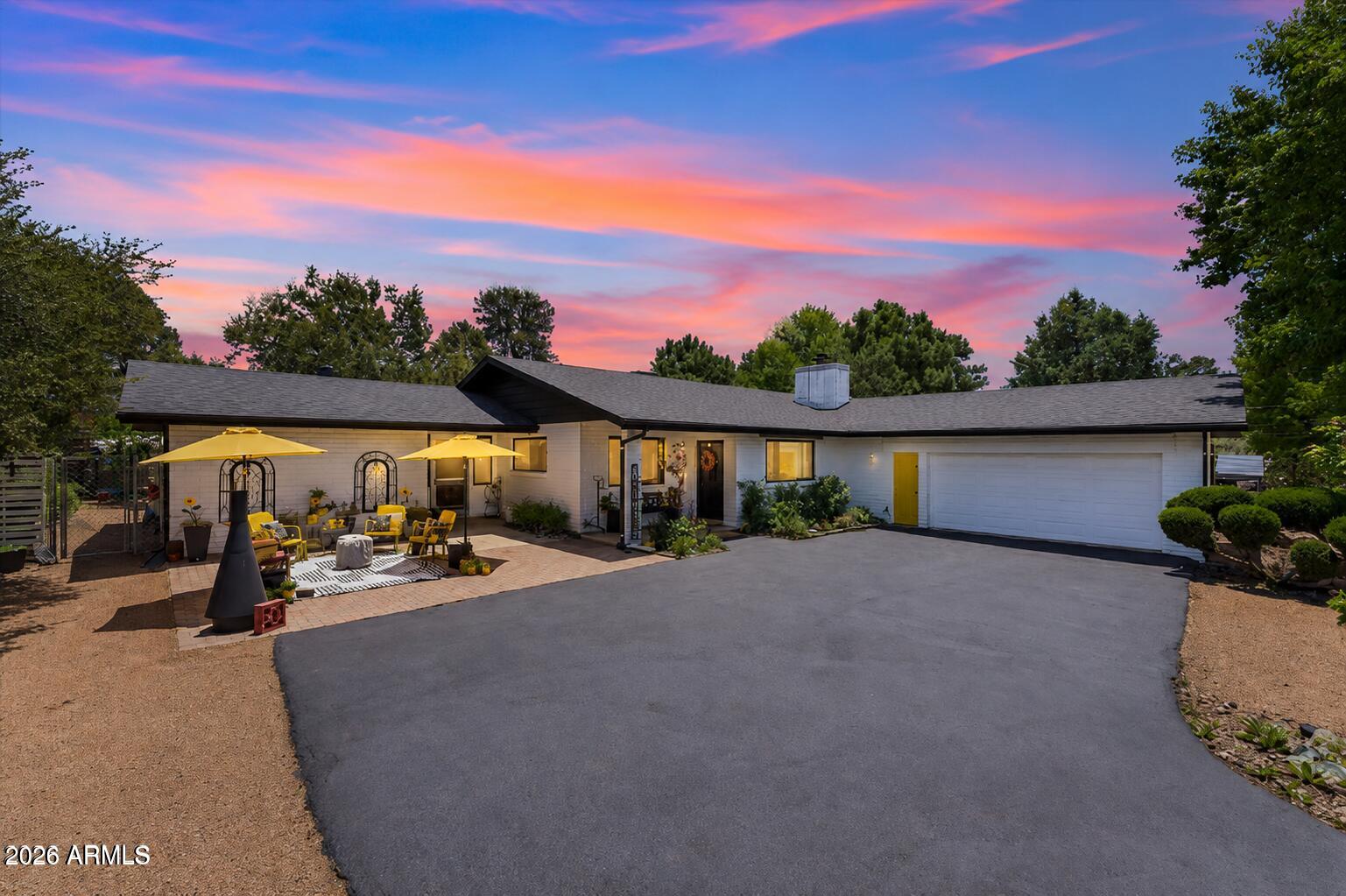 Charming Payson Retreat! This well maintained slump block home features a spacious open concept great room with a cozy brick fireplace and a desirable split floor plan. The spacious kitchen opens to the living area and includes a breakfast bar and dining space with backyard views. A newer roof and fresh exterior paint (both approx. 3 years old) add peace of mind. The heated & cooled bonus room off the breezeway is perfect as guest quarters, hobby room, office, or mother-in-law suite or 4th bedroom. Oversized 2-car garage with extra storage, fully fenced yard, private patio, fruit trees, mature shade trees and garden. No HOA, bring your RV and toys! Ideal as a full-time home, vacation getaway, or investment property. Conveniently located near shopping, schools, parks, and downtown Payson!