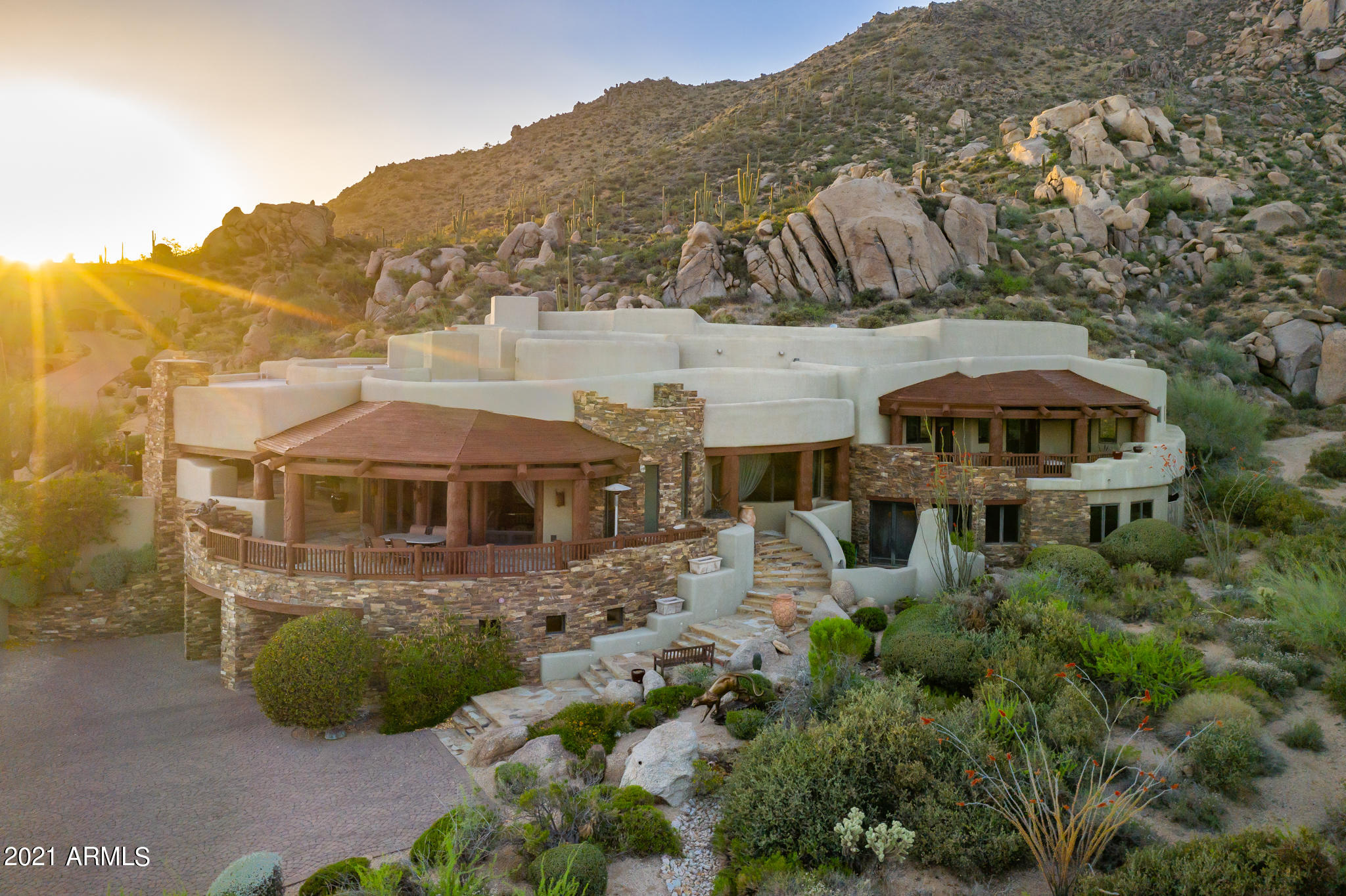 This majestic hillside estate offers picturesque views of the Valley of the Sun. Exquisite finishes abound in this Lee Hutchison Designed/Phil Smith Built masterpiece. 4 ensuite bedrooms, game room, office, wine room, gourmet kitchen, family room, living room make for the perfect home for entertaining and family enjoyment!  Wraparound Patio with fireplace, TV, barbecue, dipping pool, spa and waterfall is ideal for capturing the magic of the Sonoran desert surrounded by spectacular boulder outcroppings and unparalleled Valley views.  Truly a one of a kind home!!
Membership to The Desert Mountain Club is available through the Club.
