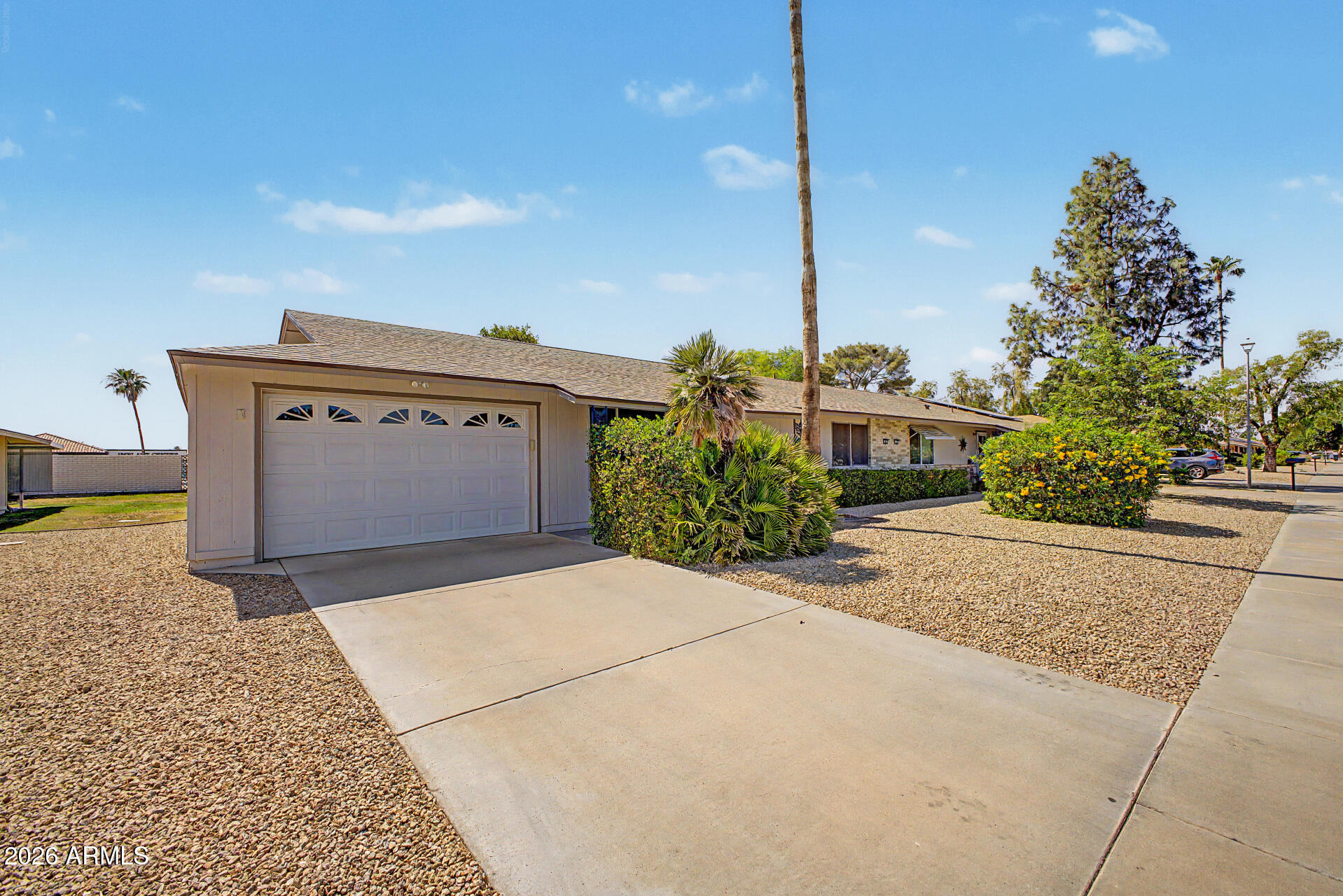 Move-in ready twin home in Sun City! 2 beds, 2 baths, 1-car garage. Close to Rec Center.

Spacious family room + formal dining area. Kitchen features pantry and abundant storage. Master bedroom fits a king bed and includes a walk-in closet. Separate laundry room with additional storage.

Newer AC and hot water heater. Enjoy the spacious grass backyard with covered patio, mature citrus tree, and greenbelt views.