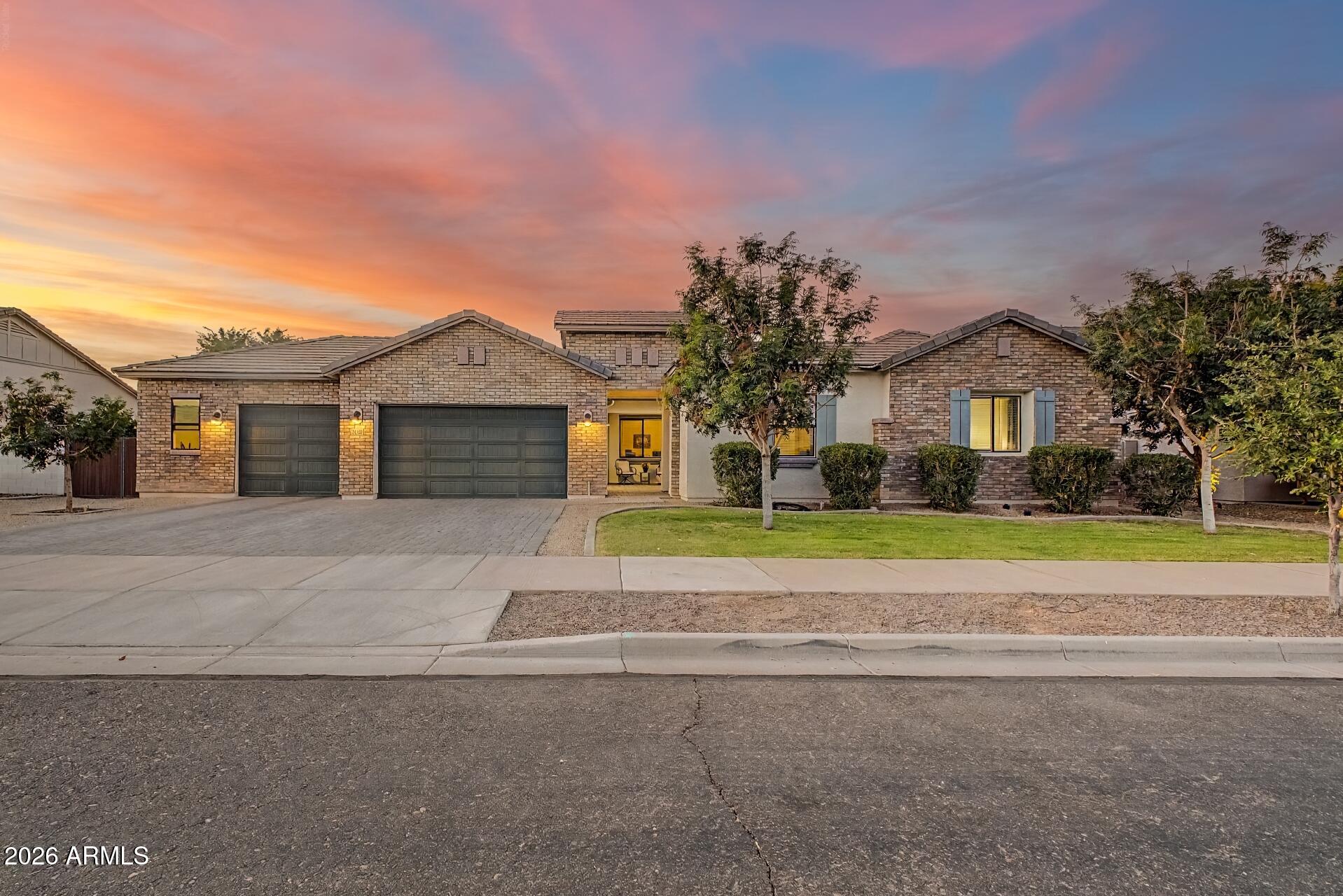 Discover exceptional MULTI-GENERATIONAL living in Queen Creek's location-central Nauvoo Station community. Positioned on an expansive 12,000 sq ft lot, this stunning 5-bedroom, 4.5-bath residence blends timeless design with modern functionality. The heart of the home is a chef-inspired gourmet kitchen featuring a gas cooktop, built-in micro-oven, oversized island, large walk-in pantry, and inviting dining nook, all flowing effortlessly into the spacious great room. The owner's suite is privately situated, offering generous space and a sun-filled bay window. The en-suite bath features a walk-in shower with a rain shower head and rain glass, while dual sinks and dual closets complete the refined, tailored feel. An enclosed den creates the perfect private office or flex space. Designed with versatility in mind, the private guest suite offers a walk-in shower, generous walk-in closet, and its own in-suite washer and dryer--ideal for extended family or long-term guests. The 3.5 car garage has an epoxy floor, overhead storage, and 220V outletThe intelligent floor plan maximizes both entertaining and everyday comfort, while the oversized homesite provides abundant room for a resort-style backyard. Located minutes from top-rated schools, shopping, dining, and recreation, this remarkable home delivers the space, quality, and lifestyle today's buyers are searching for.
