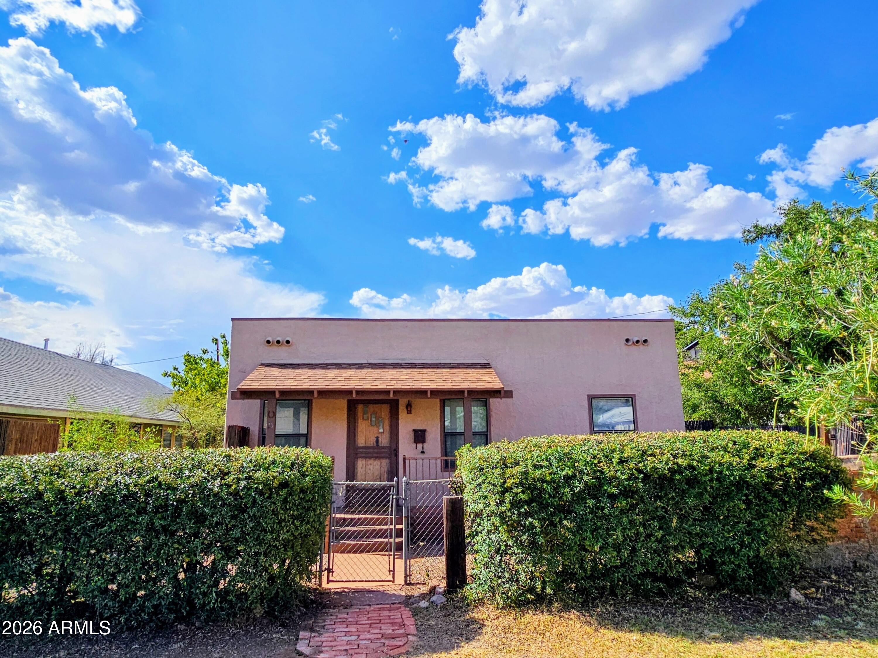 Small Footprint with Big Appeal- 702 sq. ft. 1 Bedroom/1 Bath Territorial Style Home. Solid Block Construction, Built in 1941 with Restored Original Maple Flooring, Built-Ins, and Ornate Gas Fireplace. Walk-In Closet in Bedroom, Judy Perry Murals in Living Room and Kitchen Nook, Storage Shed, Covered Front Porch, and Newer Central Heat and AC.