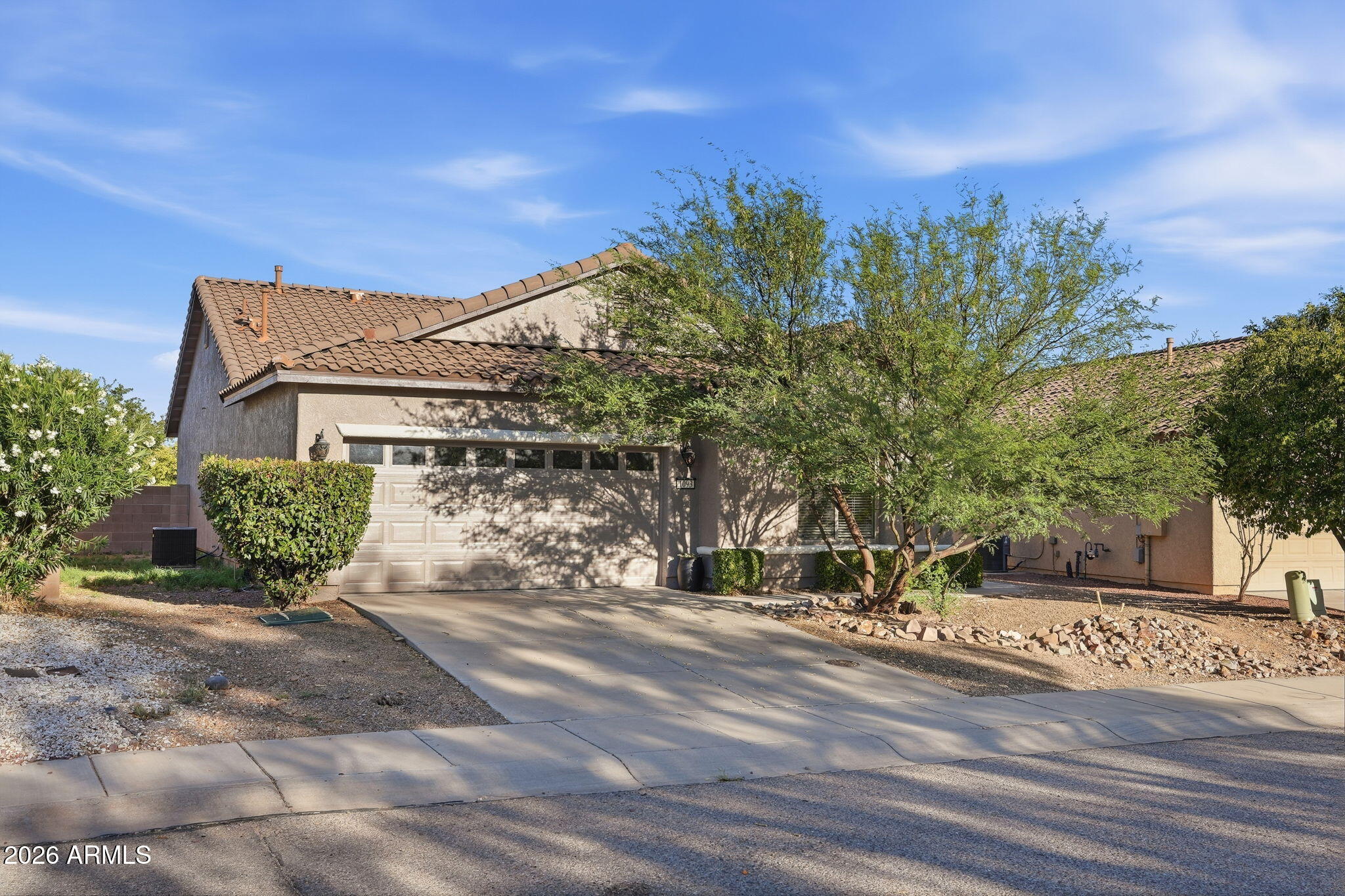Freshly painted inside and out, this beautifully updated 3-bedroom plus den home shines with new carpet and a bright, welcoming feel. The spacious split floorplan features a large kitchen with an island, walk-in pantry, and all appliances included. The master suite offers a separate tub and shower plus a generous walk-in closet. Enjoy energy savings with solar and the added convenience of a water treatment system. Outside, low-maintenance desert landscaping and a covered patio create the perfect space to relax.