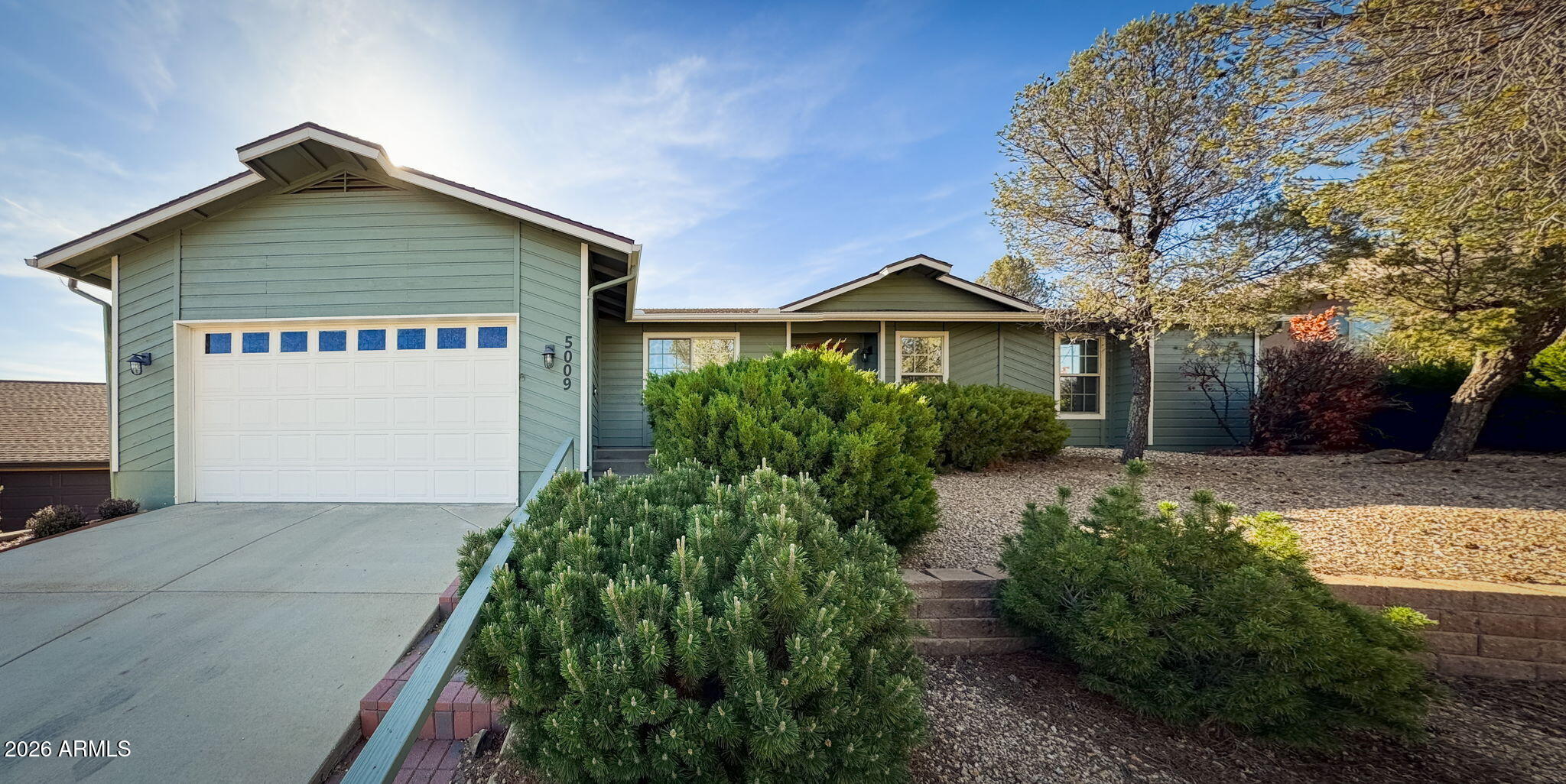 One of the more approachable opportunities to get into Yavapai Hills, this home offers strong livability, outdoor space, and location within one of Prescott's most desirable communities. Clean and well cared for with an updated primary bathroom featuring a walk-in shower and flexible layout for guests or a home office. Vaulted ceilings and natural light create an open feel in the main living area, while the fireplace adds warmth and character. The backyard feels private with mature trees and features a deck and pergola for relaxing or hosting. If you're looking for comfort, character, and value within Yavapai Hills, this is one worth seeing in person.