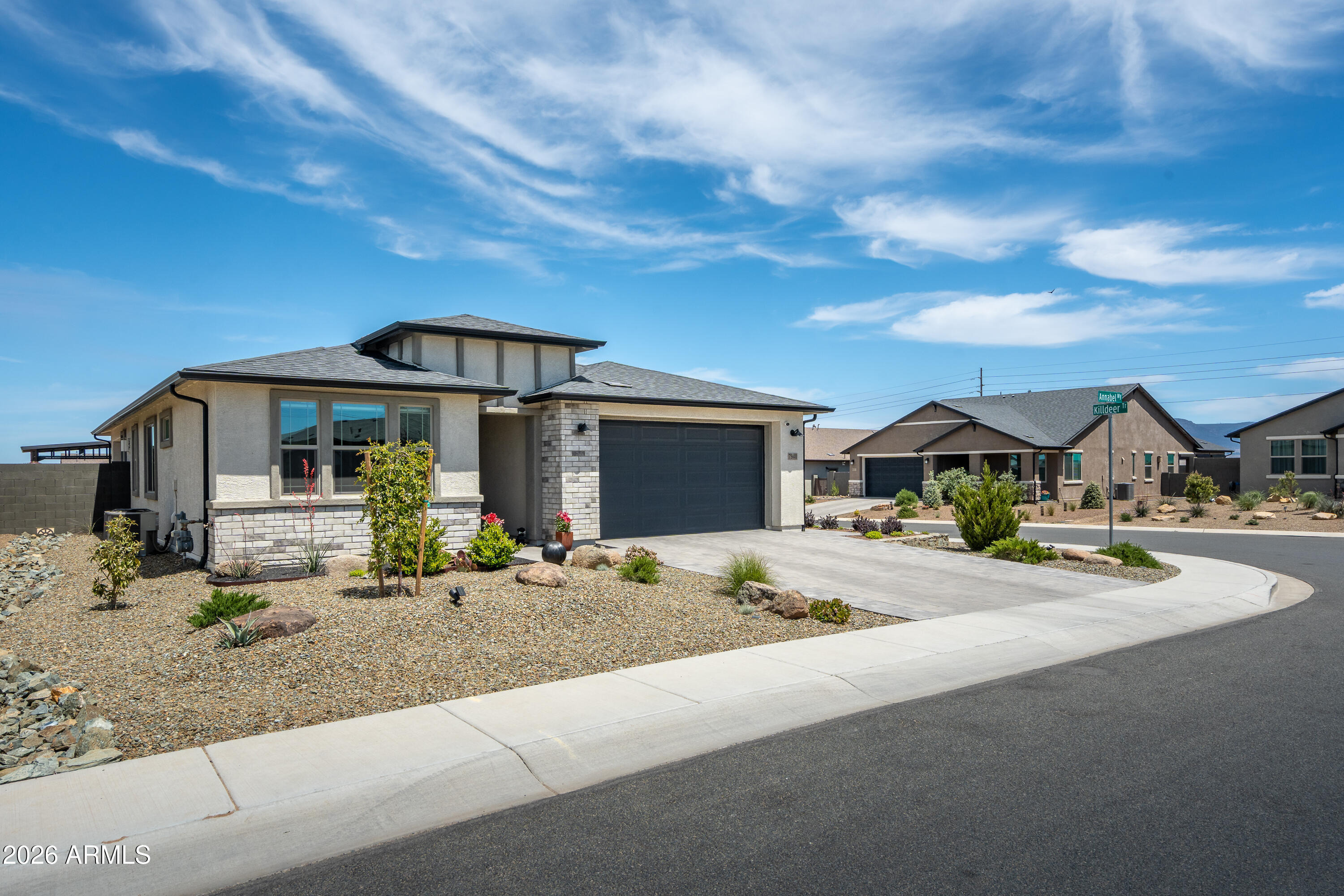 Positioned on a desirable corner lot, this single-level home showcases quality craftsmanship and high-end finishes throughout. The open-concept layout features 9+ ft ceilings, abundant natural light, and a welcoming living space with a gas fireplace. The kitchen offers granite counters, a large island, and a formal dining area. The spacious primary retreat offers comfort and functionality, complete with a generous walk-in closet. Enjoy the beautifully landscaped backyard with a covered patio and added gazebo--perfect for relaxing or entertaining. Additional highlights include a paver driveway, sprinkler/drip system, and great curb appeal.