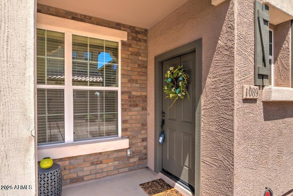 Welcome home to this beautifully designed 3 bed + office, 3.5 bath retreat in the highly sought-after Cooley Station community. Featuring 2 private primary suites and over 2,000 sqft of thoughtfully crafted living space, this home boasts an open-concept layout, granite countertops, stainless steel appliances, and a breakfast bar perfect for entertaining. The showstopper? A 4-panel sliding glass door that opens an entire wall to your private yard, blending indoor and outdoor living seamlessly. Enjoy resort-style amenities including 3 pools, spas, playgrounds, basketball courts, BBQ areas, and a cozy community fireplace. Minutes from AZ-202, top-rated schools, San Tan Village, ASU East, Apple, Intel, and Mesa Gateway Airport. Don't miss this rare opportunity. Come take a look today!