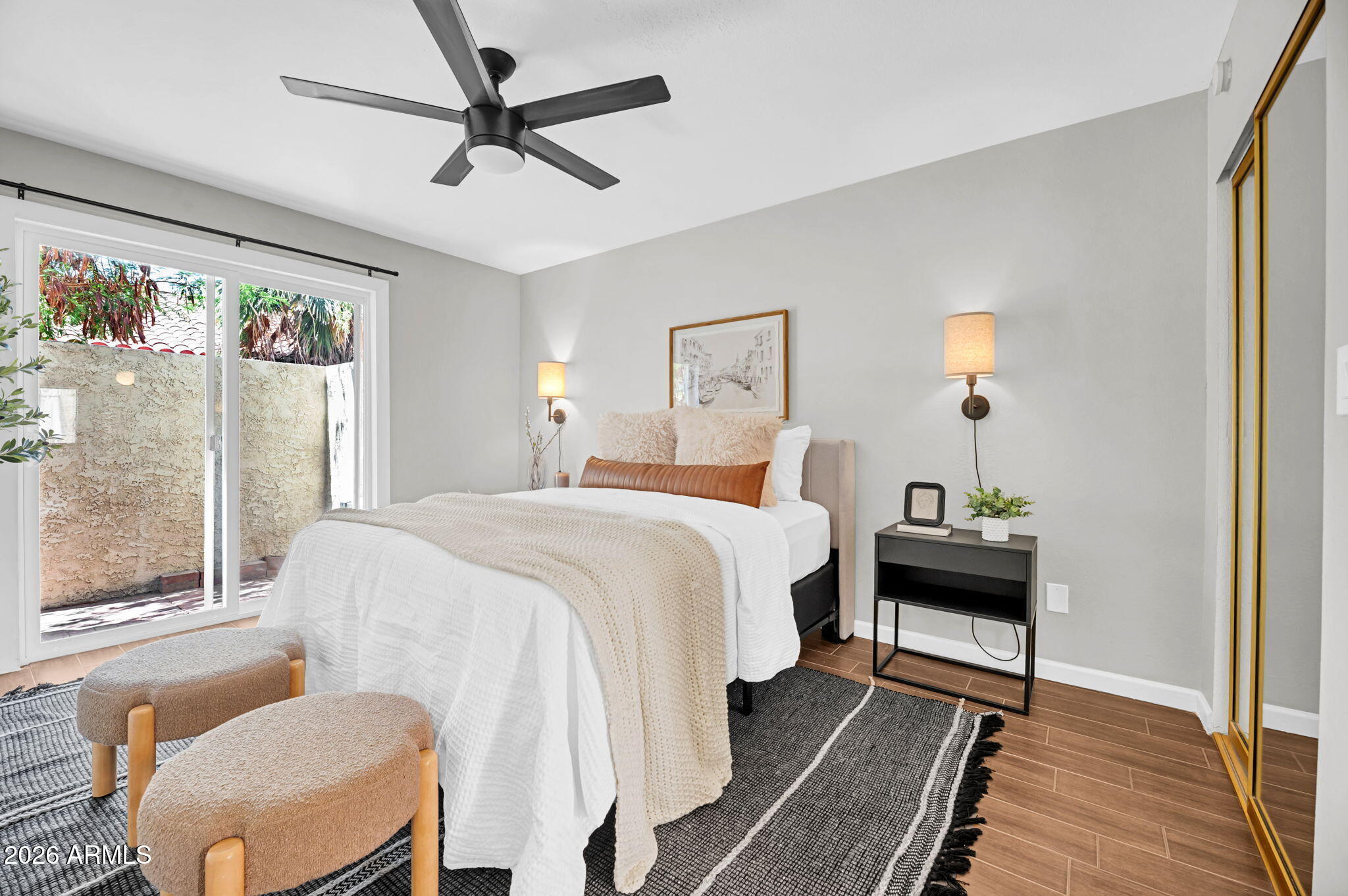Unbeatable North Central location directly on the Murphy Bridle Path! This 3BR, 2BA, 1,644 SF townhome features a brand new roof and excellent peace of mind. Enter through a private gated garden courtyard into a striking two-story living room complete with vaulted wood-plank ceilings, a fireplace, and dual patios for seamless indoor-outdoor living. The smart layout includes a rare downstairs primary suite with direct back patio access. Upstairs, you'll find two generous bedrooms and a full bath off the loft balcony. The updated kitchen boasts newer countertops and a walk-in pantry. Excellent community pool/spa and an attached 2-car carport with HOA-approved potential to enclose into a garage. Live in the vibrant heart of Phoenix!
