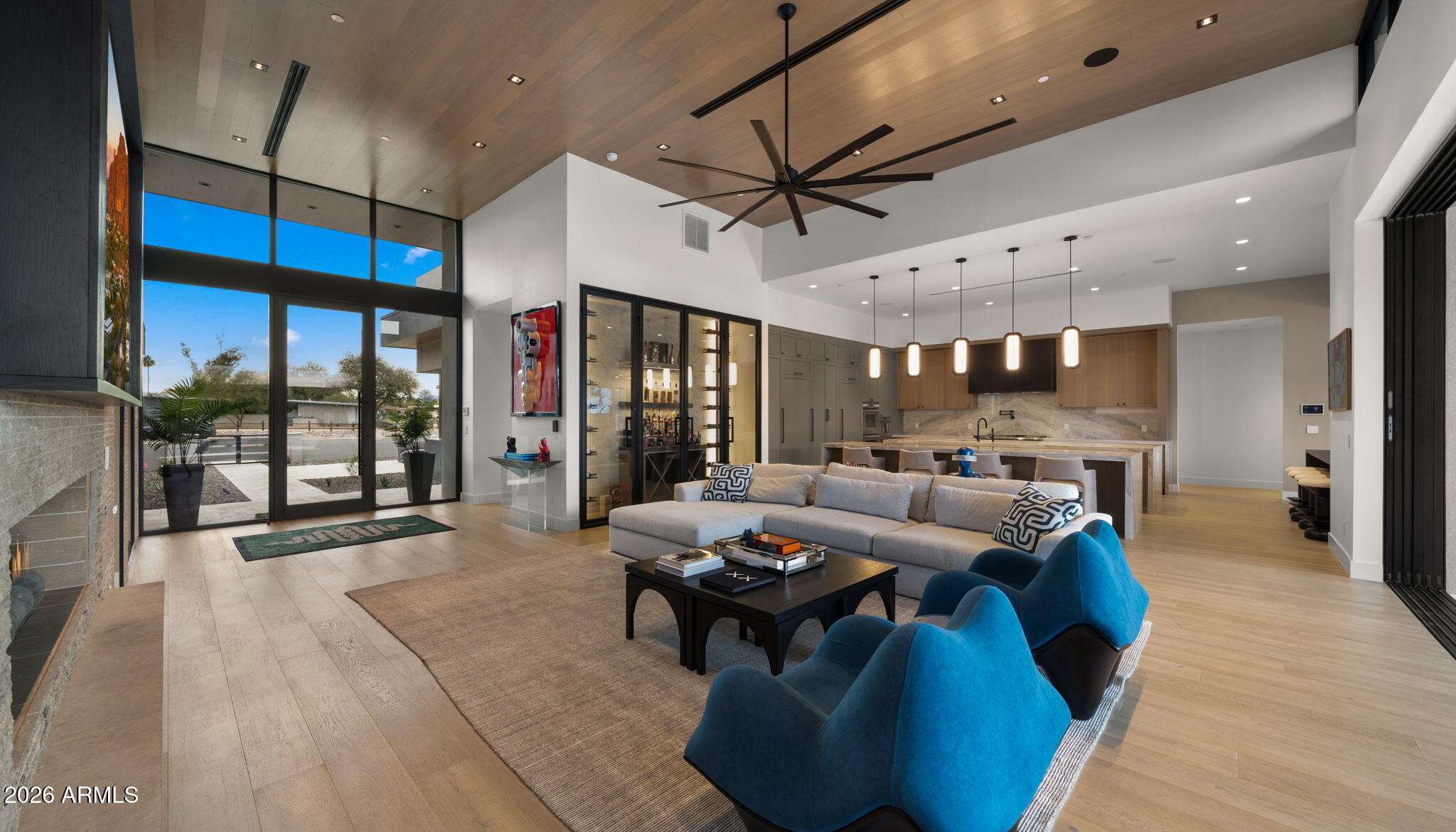 This newly built 2025 contemporary estate in the coveted Cactus Corridor delivers modern luxury and resort-style living. Offering 5,765 total marketable sq ft, including a 5,165 sq ft main residence and 600.7 sq ft guest house, the home features 5 bedrooms, 6 baths, a private movie theater, smart home AV, dual kitchen islands, designer cabinetry, hidden pantry, full bar with wine display, 4-car garage, and a resort backyard with lap pool, spa, BBQ, and batting cage. This newly built 2025 contemporary estate in the highly sought after Cactus Corridor offers the ultimate in modern luxury and resort style living. The main residence spans 5,165 sq ft, complemented by a 600 sq ft guest house, for a total marketable square footage of 5,765 sq ft.
Designed for both entertaining and everyday comfort, the home features 5 bedrooms and 6 bathrooms, a private movie theater, and full smart home AV integration throughout. The chef's kitchen showcases dual islands, designer cabinetry, and a hidden walk-in pantry, flowing seamlessly into a sleek family room with floor to ceiling sliding glass doors, 14 foot ceilings, and a striking modern fireplace perfectly capturing Arizona's indoor/outdoor lifestyle.
Entertain with ease at the full bar, complete with an ice maker, wine fridge, and a temperature controlled wine display. Guests will appreciate the private guest house, while car enthusiasts will love the 4 car garage.
The resort style backyard is truly one of a kind, featuring a lap pool with spa, built-in BBQ, batting cage, and multiple outdoor living spaces ideal for relaxation or hosting unforgettable gatherings.
A rare opportunity to own a brand new, design forward estate in one of Scottsdale's most desirable corridors.