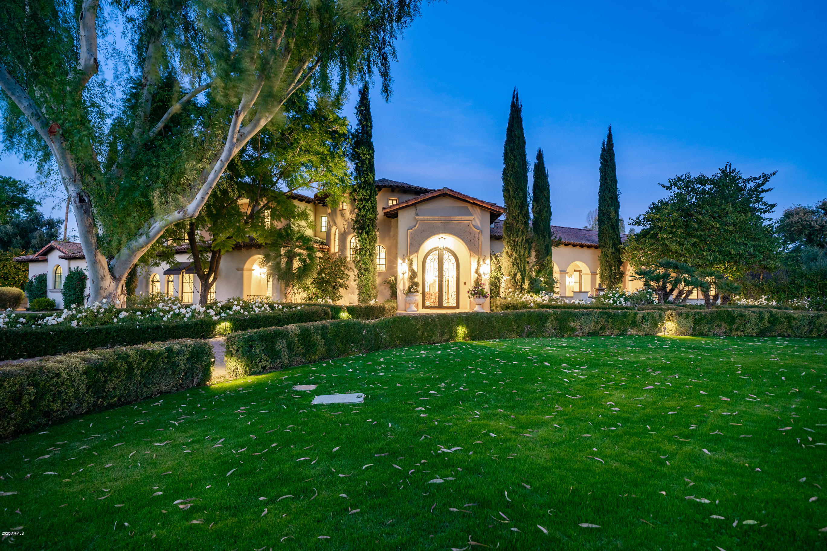 Completely reimagined in 2017, this exceptional Santa Barbara inspired custom home in the heart of Paradise Valley offers unmatched finishes on a lush & private corner parcel. Stunning street presence invites you to take in refreshing details from start to finish. Dramatic high ceilings with custom touches, new designer lighting & white Venetian plaster create an immediate ''wow'' factor. Stone & wood floors, Cantera stone fireplaces, furniture grade cabinetry & many other luxurious features grace this thoughtfully remodeled home . Formal living & dining lead to perfectly appointed gourmet kitchen & family room with updated wet bar. Charming powder room & brand new 800-bottle wine room are crowning touches. Ground floor split owners' retreat with luxurious spa bath, dressing areas & built-in cabinetry is truly a sanctuary. Also on the first level is a full guest suite with living, bedroom & full bath providing a perfectly private guest experience. Fully equipped home theatre with custom paneling & full bath round out this well planned first level. Grand foyer staircase leads to second level guest spaces with loft corridor overlooking family room & kitchen. Ensuite bedroom with full bath, plus additional bedroom/bath plus game room offer flexibility for guests. Completely appointed guest house provides spacious living room & kitchen, 1/2 bath, bedroom with full bath & laundry - perfect for live-in family and long term visitors. The back yard is sprawling with plenty of covered patio entertaining space, refreshing pool & spa, BBQ area with mature trees & lush grounds. For a list of features & improvements, please see the Documents Tab. 6800 Caballo is exceptional and truly celebrates the Paradise Valley lifestyle.