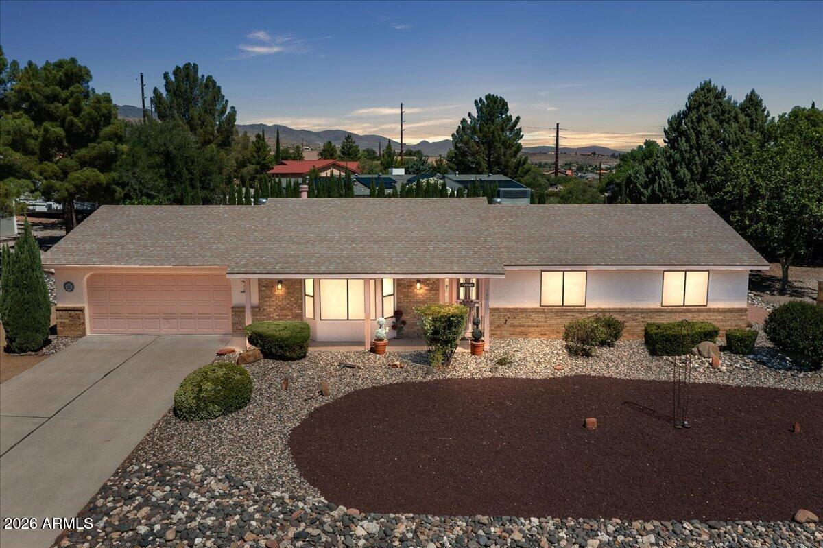 You will  feel the LOVE in this very well maintained home as you enter the Great Room with beamed cathedral ceiling, wood burning stove, soft carpeting, and bay window overlooking the meticulously maintained front yard...The dining area adjoins the living room and flows into the galley kitchen with granite tops and all appliances...Master Bedroom enjoys a 3/4 bath with beautiful walk in shower, double sinks &  large wall closet....Guest bedrooms share a 3/4 bath with showe...Flooring is a  lxuxury vinyl plank...A slider from dining area takes you to the covered rear patio and beautiful spacious backyard....Laundry is off the kitchen and includes counter and cabinets....Two car attached garage has expoxy floor,  insulated overhead door, a split hvac system, and seperate workshop with bench.