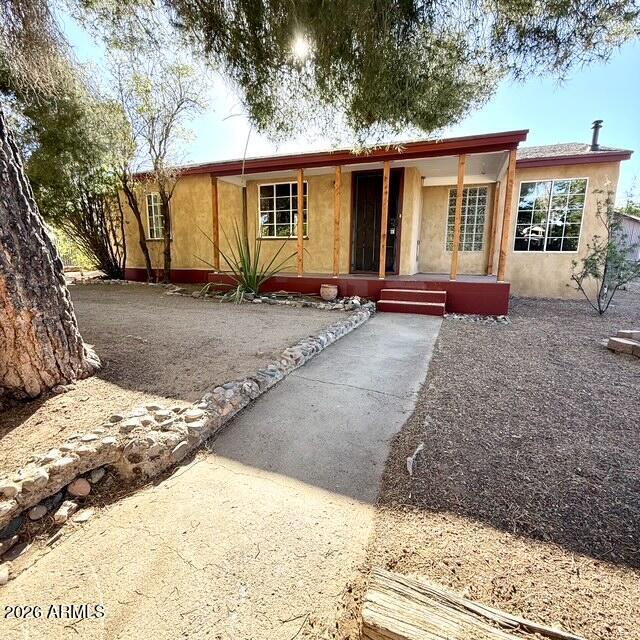 This 1956 3 bedroom 2 bath adorable bungalow offers many unique features including a sunken den/office with lots of light, custom eat-in kitchen with copper sink, luxurious master bath, BBQ patio, detached workshop with 220v, carport and secluded studio. Its mature shade trees, fenced yard, bedroom private entrance and street access both front and back add to its versatility and charm.

Its ideal location near Warren's historic district puts you moments away from parks, restaurants, shops and services with Copper Queen Community Hospital, Bisbee public schools, Police, Fire Dept and Dollar General all just a 5 minute drive or less! Make this beautiful home in Warren's quiet and secluded East Galena subdivision your own private sanctuary!