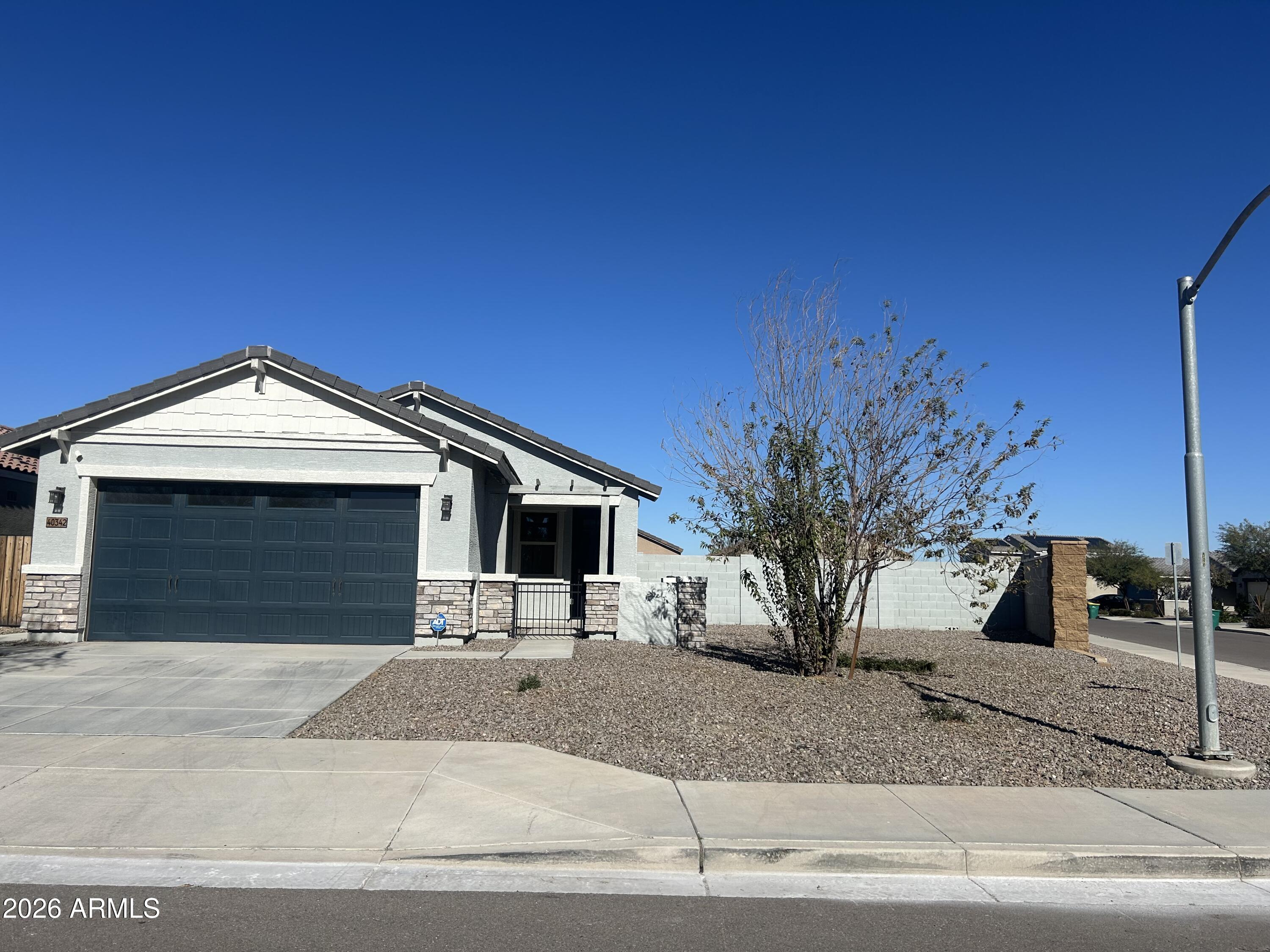 Barely lived in home, this energy efficient home built by Meritage has 4 bedrooms and 2 full bathrooms.  2026 updates include NEW 2'' Faux wood blinds.  NEW gas stove and dishwasher.  Refrigerator, microwave, washer and dryer included.  Granite countertops and kitchen island.  Interior painted neutral.  NEW carpet in bedrooms (Feb 2026).  Primary bathroom has walk in closet, doiuble vanities and walk-in shower.  Fans in all rooms.  Corner lot with HUGE low mainteance backyard with pavers and extended patio. OWNER/AGENT