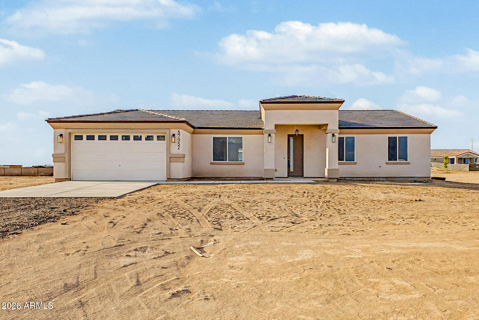 3 minutes from the I-10 Wintersburg exit - no dirt, no gravel, all paved access-this brand new custom home delivers the best of Tonopah! space, freedom, and convenience. Sitting on 1.17 acres with horse rights, NO HOA, and room for your RV, workshop, or horse stalls, this 4 bed, 3 bath home offers over 2,000 sqft of thoughtful living space. Vaulted ceilings soar over the kitchen, dining, and living areas, complemented by upgraded countertops, tile throughout, and brand-new stainless steel appliances all included. Split floor plan features a spacious master suite & junior suite, perfect for guests or multi-generational living. Upgraded bathrooms neutral tones complete the package. Quality built home & peaceful acre living without sacrificing highway access and convenience, this is the one!