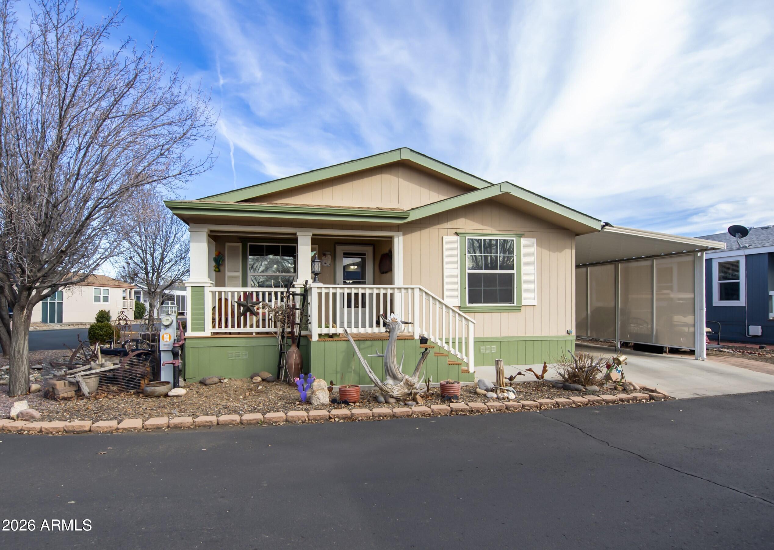 Fabulous 1500 Square Foot, 2010 CAVCO Double Wide in Highly Popular Orchard Ranch/55 Plus Community on a Corner Lot!!! This Beauty has an Open/Split Floor Plan, 2 Master Bedrooms/2Bathrooms, & a 2 Car Carport + 10'x10' Workshop/Storage Shed. Home has GREAT ROOM Concept, Luxury Vinyl Plank Flooring, Upgraded Light Fixtures, Horizontal Blinds w/Shear Valance's, Ceiling Fans, Solar Tube, Plant shelves, & Built In Entertainment Center/Buffet. Kitchen is Well Appointed with Maple Cabinetry, Under Cupboard Lighting, Pullouts, Pantry, ISLAND, Laminate Countertops, Functional Bay Window/Breakfast Nook, Quality White Appliances (Inc. Fridge, Electric Range, Micro, Dishwasher, & comes with NEWER Black Stainless Stack Washer/Dryer). Primary Bedroom is Spacious, has large Closet, Single Sink, &... Large Walk-In Shower. Additional features include 6-year-old HVAC, 2025 30 Gallon Hot Water Heater, Private Screened in Back Deck, Covered Front TREX Deck, Open Patio under Carport, & has a Golf Cart Pad. Home is in TURNKEY Condition & is Priced to Sell!!!!  Land lease is $625/mo.