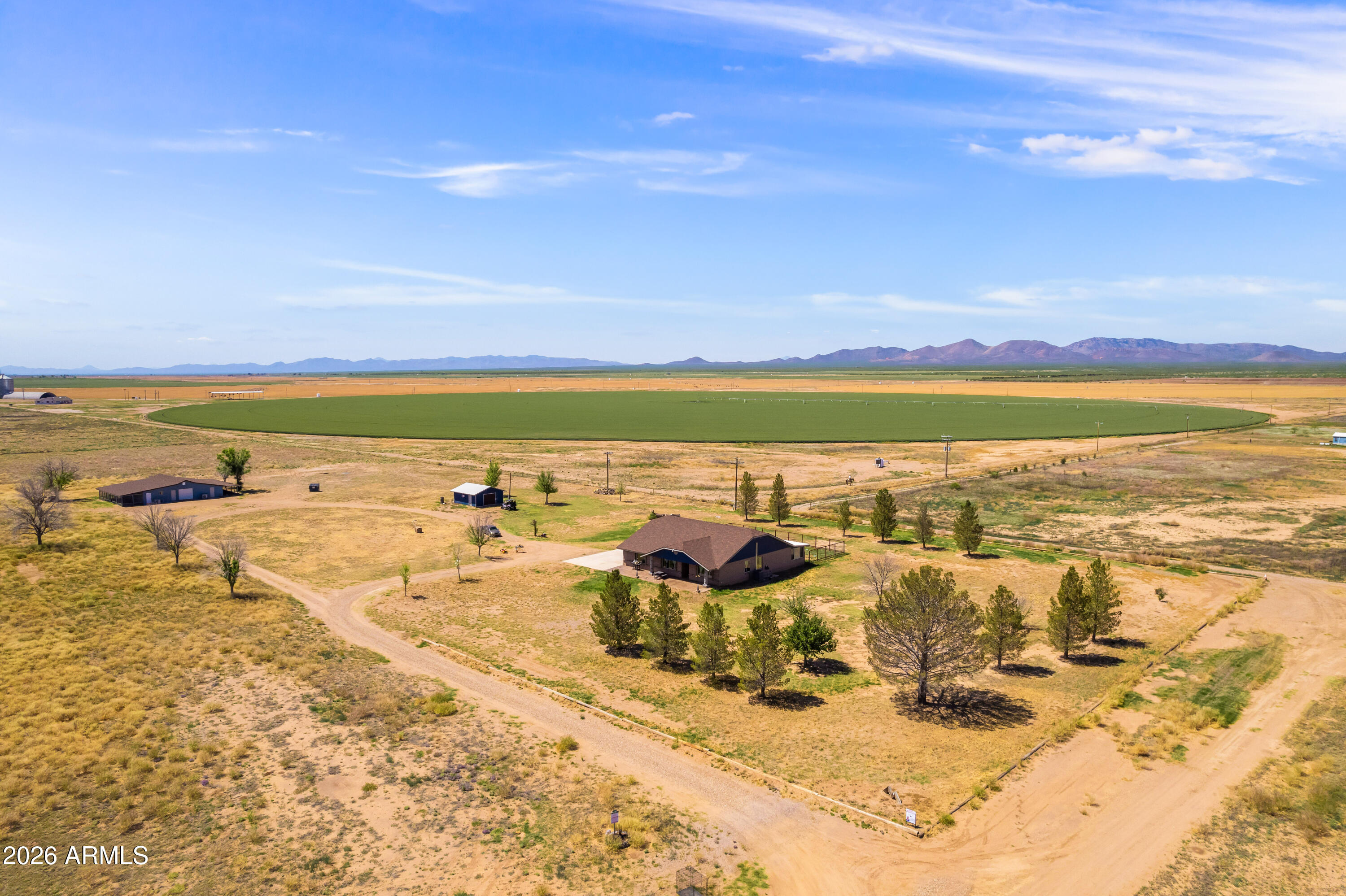 Enjoy wide open space and breathtaking 360° views with this custom 3-bedroom, 2-bath home situated offering 2,728 sq ft, on 25 acres of peaceful countryside. Designed with a desirable split floor plan, the home offers privacy and functionality with spacious living areas throughout.   Inside, you'll find both a living room and a separate family room, providing plenty of space for relaxing or entertaining. The heated and cooled sunroom offers a bright and comfortable space to enjoy the surrounding landscape year-round.   A standout feature of this property is the 2,300 sq ft fully equipped dog kennel facility, perfect for breeders, trainers, or animal enthusiasts. The kennel includes five runs, grooming space, temperature-controlled areas, security cameras, and a convenient half bathroom, creating a professional and efficient setup for animal care.  The entire 25 acres is equipped with an invisible dog fence, allowing pets to roam freely while remaining safely contained. Additional features include a private well and a security system that will convey with the home for added peace of mind.  With expansive acreage, incredible panoramic views, and specialized facilities already in place, this property offers a rare opportunity for country living with a turnkey animal care operation.