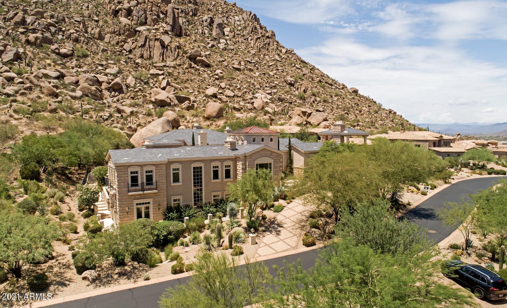 Up close and personal with Troon Mountain, these views are breathtaking from your private backyard or roof top deck. Custom built, charming estate with 5 bedrooms 5.5 baths, theater, office, gym, walk out basement with bar and kitchenette. Outdoor features include a negative edge pool, spa, outdoor  kitchen and fireplace with quaint sitting areas.  Beautiful chef's kitchen with Viking appliance package and a separate elegant formal dining room that is perfect for entertaining.