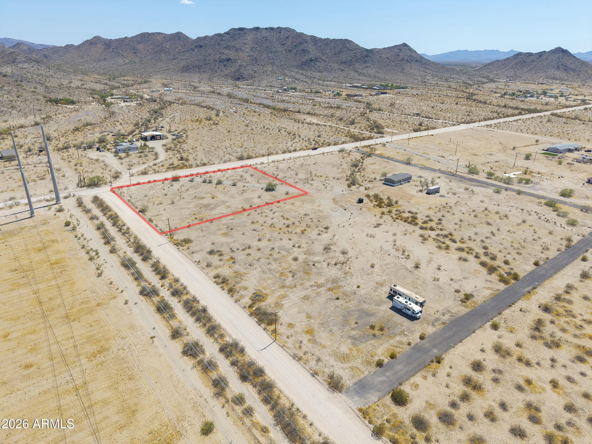 Escape the hustle & enjoy the freedom of wide-open desert living! This 1.24-acre parcel in Hidden Valley offers the perfect opportunity to create the lifestyle you've been dreaming of! With a level, fully cleared lot, shared well access & electric nearby, much of the groundwork is already in place for your future plans. Build your custom home, bring the horses, RVs, trailers & toys & enjoy the freedom of NO HOA! Surrounded by stunning mountain views, peaceful desert scenery & unforgettable Arizona sunsets, you'll feel worlds away while still being conveniently located near Maricopa & Casa Grande. Your piece of the Arizona desert is waiting! Adjacent properties also available!