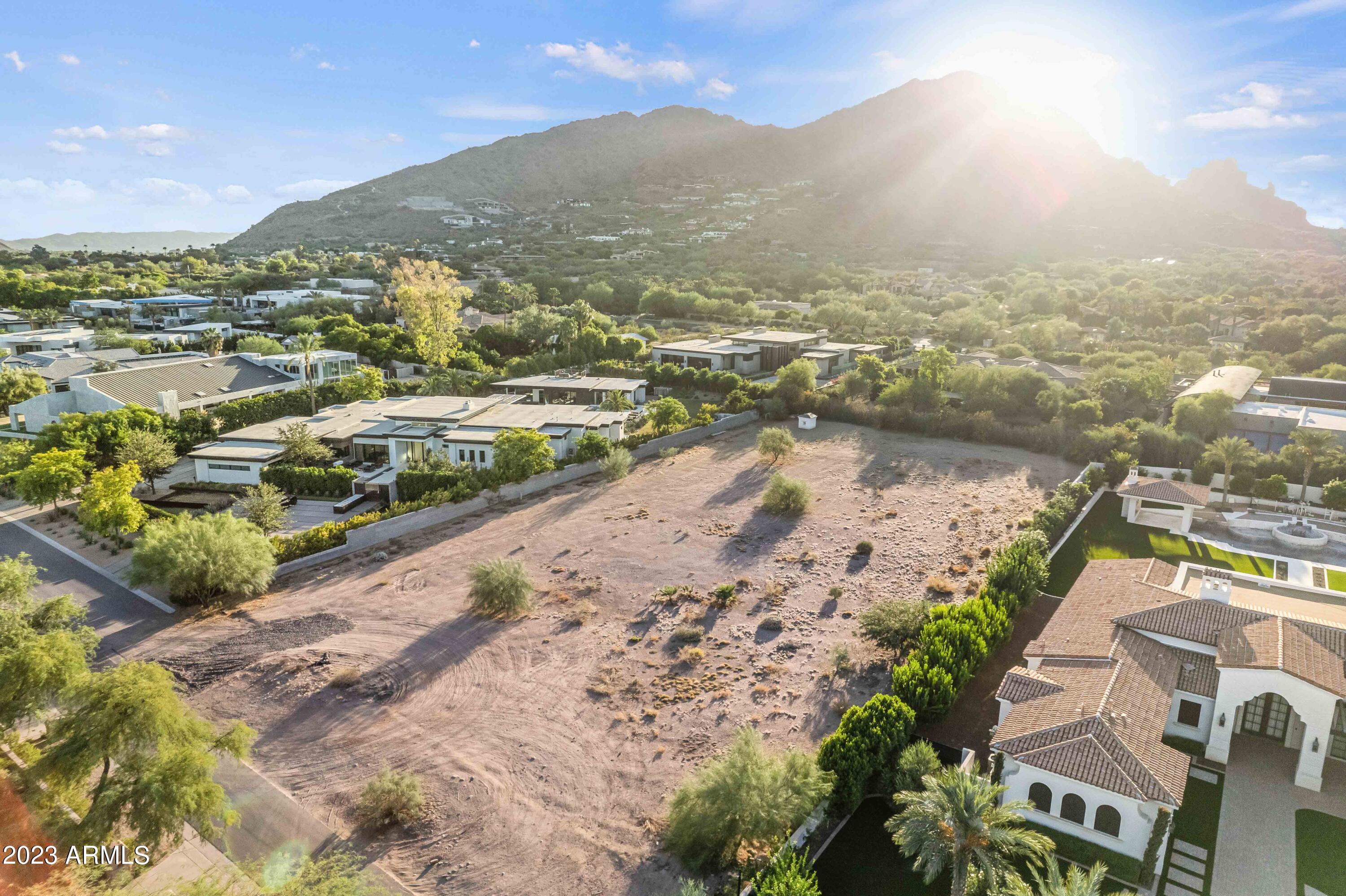 Undoubtedly the best 1.17 acre lot - on or off the market - in Paradise Valley! The last available lot located on one of PV's most desirable streets, the property's build and landscape-friendly rectangular lot welcome unparalleled, unobstructed views of Camelback Mountain and the Monk. Ideal location ensures total privacy yet provides easy access to PV's main attractions, including the Ritz Carlton, and primary arterials. Unique secondary flag access off Badgett Lane ready for use as guest or maintenance entrance. Lot is build ready, with pad prep complete. There has not been a lot available like this. And there won't be another. It won't last long!