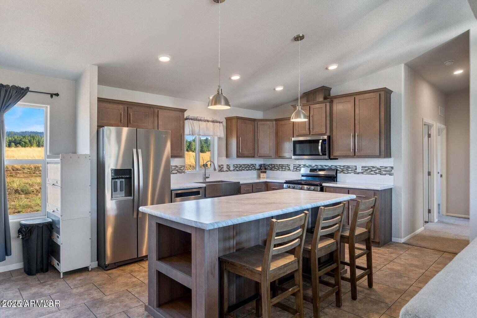 Modern Mountain Retreat with River Views, Greenhouse— Ready for Off-Grid Potential with NO HOA!!! Welcome to your serene escape along the San Francisco River—this 2021 Champion AF2856E manufactured home offers 1,493 sq ft of well-designed living space, featuring 3 bedrooms and 2 full bathrooms. This home boasts 2x6 construction for superior snow load and wind resistance, as well as enhanced insulation for optimal winter comfort. Inside, you'll find an inviting open-concept floor plan. The kitchen is a true centerpiece, offering a large farm-style sink, an expansive island perfect for entertaining, and seamless flow into the living room. The spacious primary suite includes a generous walk-in closet and a luxurious bathroom with a garden tub surrounded by windows ideal for relaxing while soaking in the view.
