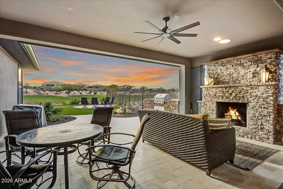 STUNNING GOLF COURSE VIEWS! Welcome to the life of LUXURY at Trilogy at Verde River! This stunning Ironwood floor plan is situated on the coveted golf course homesite offering gorgeous views from the front and the back. The sophisticated interior boasts wood-look tile flooring, upscale ceiling fans/light fixtures, pre-wired surround sound, plantation shutters, and a den/office with double doors. Expanded sliding glass doors to the back patio bring the outdoors in. Elegant chef's kitchen offers ample cabinets with crown molding and designer hardware, a walk-in pantry, SS appliances, granite counters, stylish tile. The grand primary suite showcases a pristine ensuite with dual sinks, a designer tile shower and large walk-in closet. Enjoy stunning sunsets behind the mountains & a spectacular golf course view. Create lasting memories in the backyard comprised of a covered patio with an exterior fireplace, built-in grill and extended pavers. 
If Luxury and Resort Living is what you are after, this home is for you!
Trilogy at Verde River offers upscale Resort living at its finest and the very best of all possible worlds, close to the conveniences of affluent North Scottsdale, yet secreted within the pristine privacy of the Sonoran Desert. The amenities are World Class with Tom Lehman inspired eighteen-hole Golf course, tennis courts, pickle ball courts, and bocce ball, heated lap pool and Resort style swimming pool, hot tub, Afterburn fitness center, Helen's demonstration Kitchen for cooking classes and a 7.5 acre dog park. The community center has casual poolside dining at Eddy's Diner and gourmet dining at award-winning Needle Rock Kitchen and Tap, Alvea Spa with full-service Salon and Spa amenities, Art Loft and events center. Trilogy at Verde River is adjacent to the Tonto National Forest and is situated in the middle of miles and miles of hiking and biking trails.

Whether you're seeking a second, winter home, or will live here year-round, Trilogy at Verde River is an ideal distance from the hustle and bustle of North Scottsdale. You'll love the Resort living!