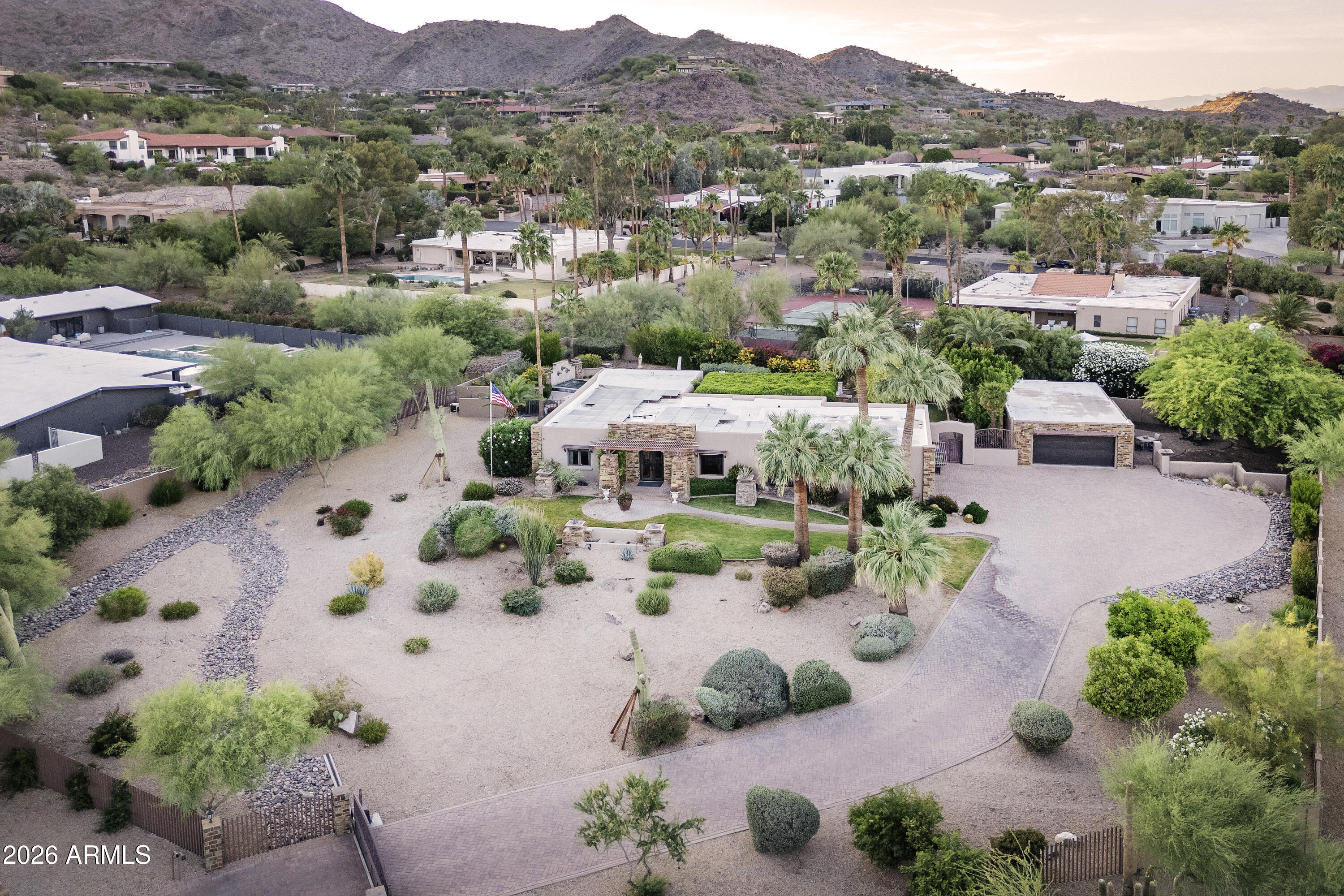Privately gated and perched on nearly 1.6 elevated acres, this exceptional property showcases breathtaking views of Camelback Mountain. Enjoy the existing residence and guest house as they are, renovate to suit your vision, or create a spectacular custom estate on this premier homesite.