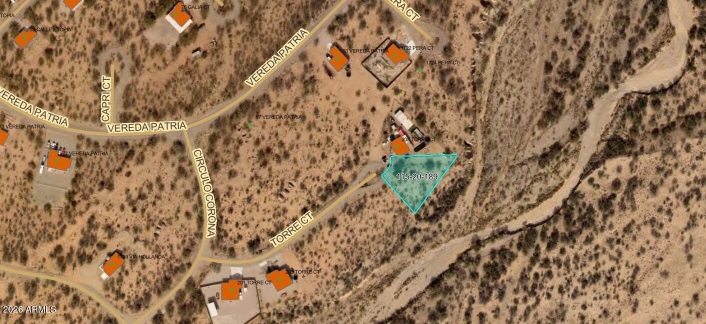 Vacant residential lot in an established Rio Rico neighborhood. Water availability pending utility confirmation. Property contains a regulated riparian habitat area -- Flood Hazard Information Sheet available upon request. Property sold as-is. Seller holds equitable interest.
