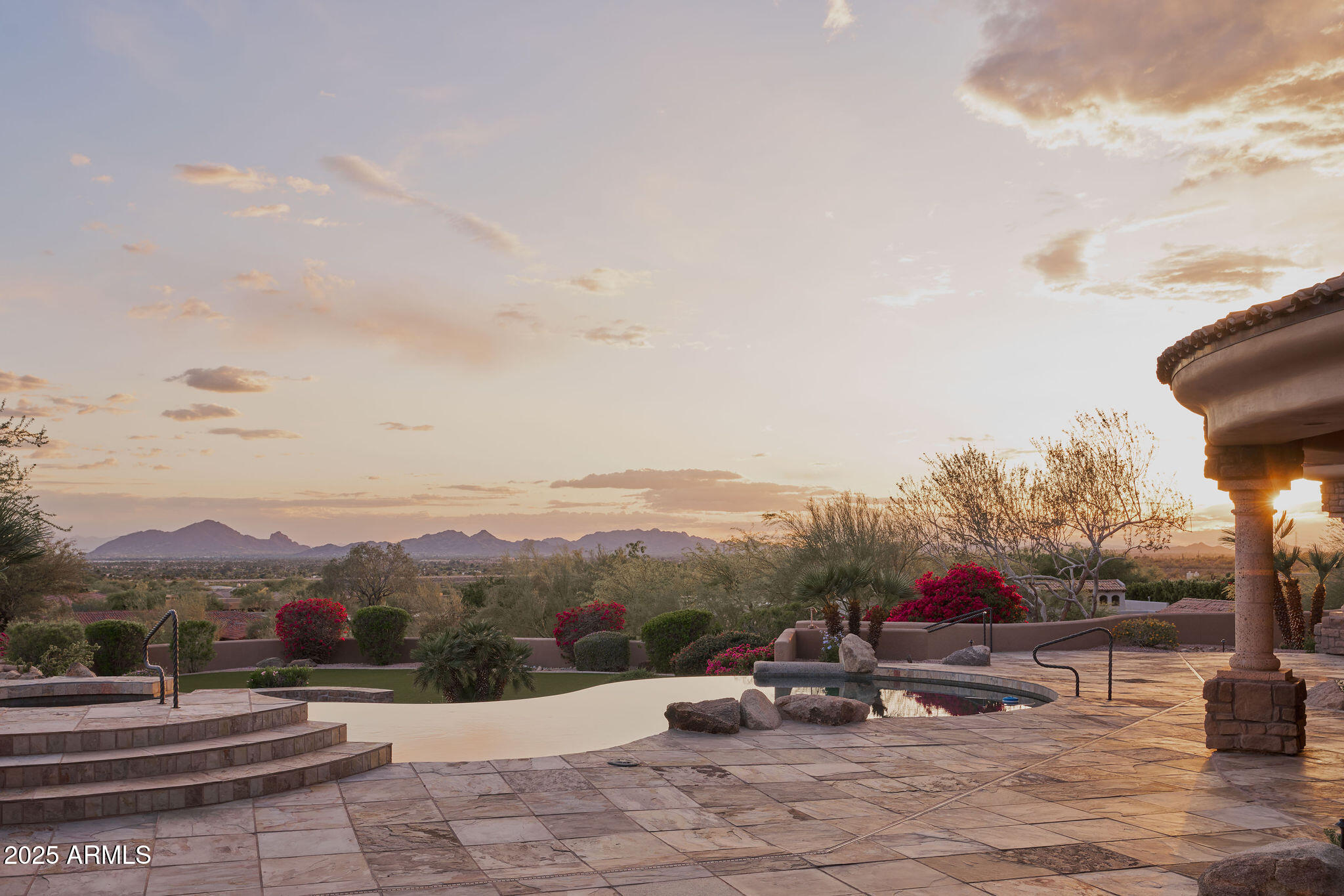 Dramatic, expansive Camelback and valley views greet you upon entering this stunning home on a premier, elevated lot in 24hr guard gated Ancala community. Well-designed layout all on one level with no interior steps. Vast views, extensive covered & open patios, fireplace, negative edge pool/spa, large turf area w/ additional patio & fire pit create a dramatic experience while remaining very private. Gourmet kitchen w/ large island opens to family room. Primary suite w/ large sitting area and fireplace captures the views. All bedrooms are ensuite w/ walk-in closets. Stately office, theater, wine room, 5 car garage parking and many additional features. Intimate front courtyard w/ fountain & fireplace leads to the lovely casita w/ living, BR & private patio. This is a very special property.