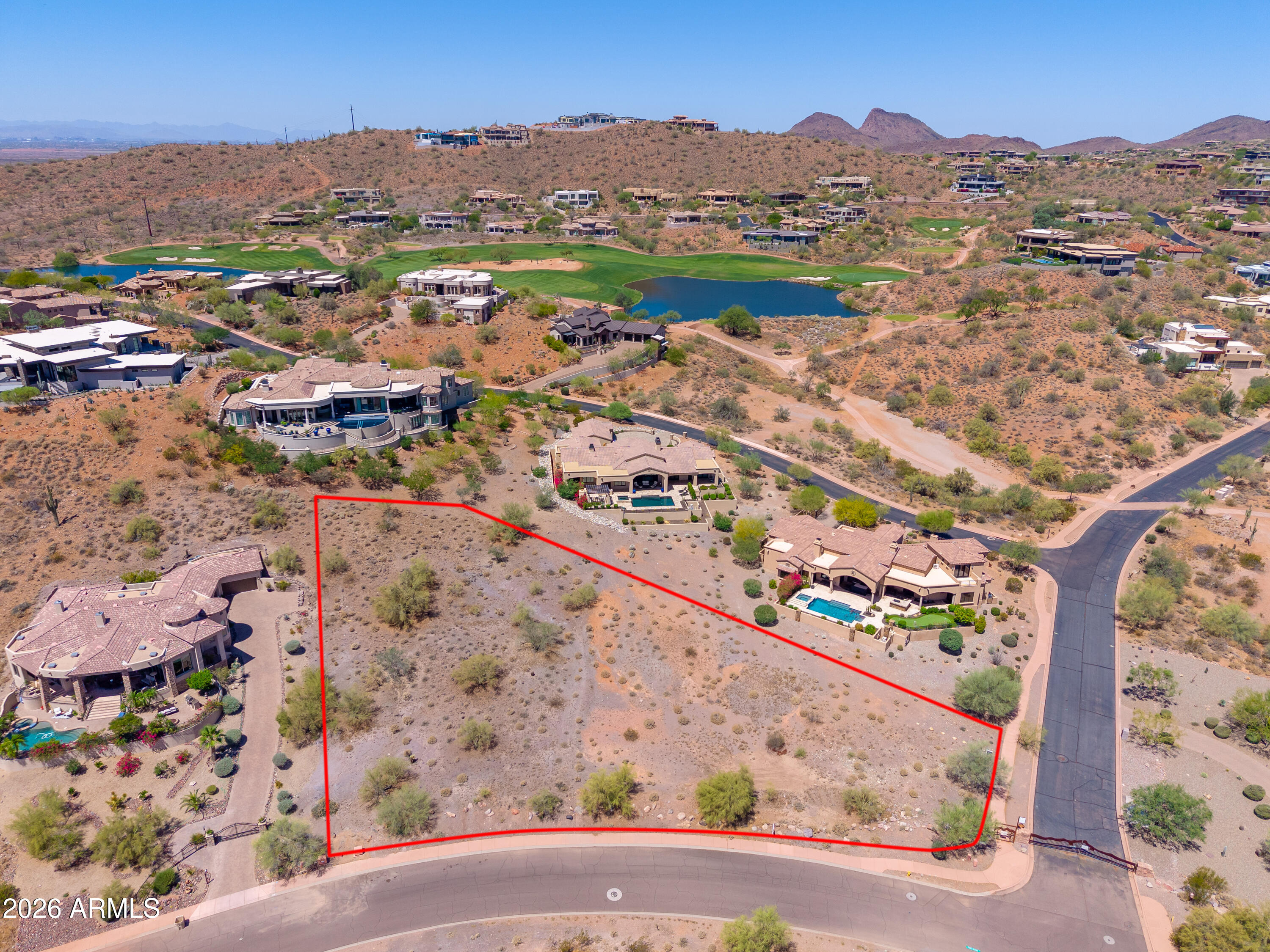 Beautiful gentle sloping lot, just shy of an acre at the back gate of Firerock Country Club. Mountain views, some golf course views, easy build. This property is located in the Firerock plat, outside the gate of Firerock Country Club, with a small portion on the in side of the gate. (see plat in the doc tab )There is no HOA or design review restrictions, permits through the Town of Fountain Hills . There are all utilities including natural gas to the property.