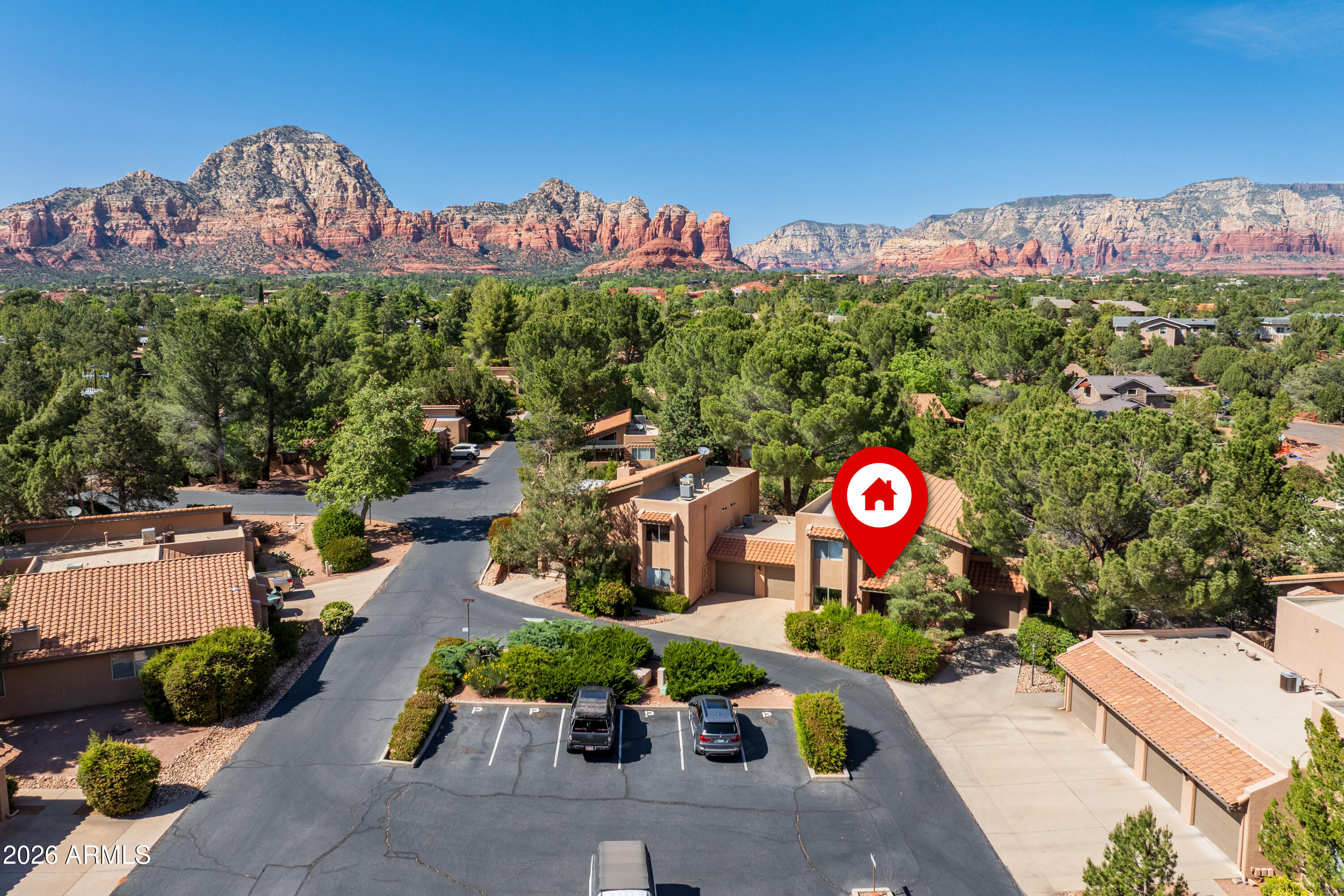 Welcome to the Morning Sun Community. This move-in ready ground-floor condo is in one of Sedona's best spots. This 2-bed, 2-bath home features an open layout with upgraded maple cabinetry, granite countertops, and luxury vinyl plank flooring throughout. Step outside to your private patio and soak in the stunning surroundings with a wash bordering the property. Sunset Park is just steps away, and the Sedona Airport Loop Trail is perfect for weekend hikes. Groceries, dining, and Harkins Theatres are all nearby. Cool off at the community pool or hang out at the clubhouse that is just outside the front door. Worry-free living with red rock views -- what's not to love? Seller will consider owner financing at a rate lower than conventional interest rates.