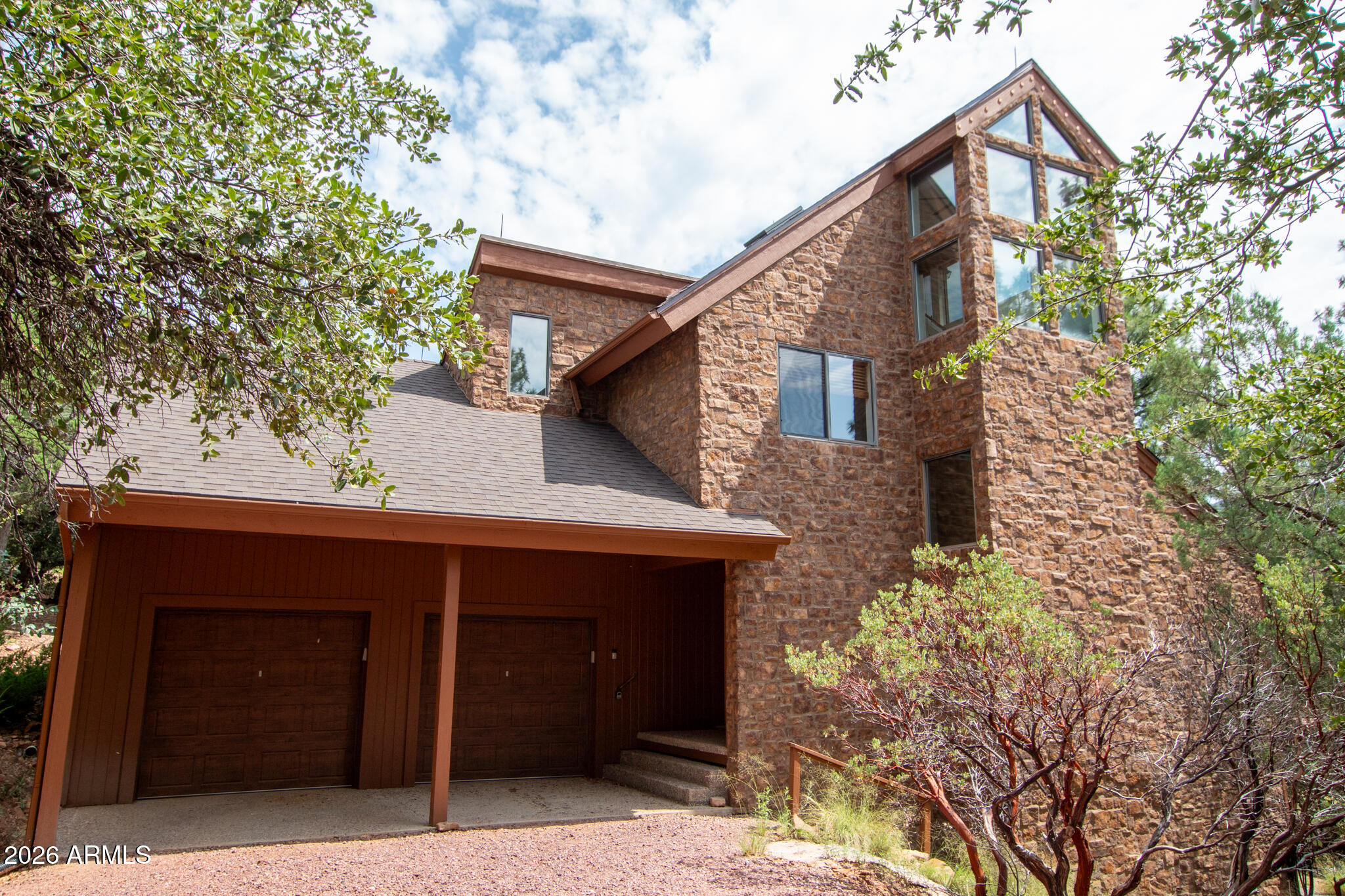 Trade the noise of the city for fresh mountain air in beautiful Pine, AZ! This expansive 4-bedroom, 3-bathroom home offers 3,068 square feet of living space surrounded by towering pines and sweeping, endless views. Blending classic cabin charm with modern touches, the home features a smooth, level entry and an open-concept layout connecting the living, dining, and kitchen areas. The living room invites you to relax by the cozy fireplace or step out onto the balcony to take in the stunning scenery. The kitchen is a standout with rich Indian marble countertops and high-quality appliances, perfect for both everyday living and entertaining. The main level also includes a bedroom, full bathroom, convenient garage access, and a spacious deck designed to capture those incredible views. More... Downstairs, you'll find a warm and inviting family room with a second fireplace, a private patio with mountain vistas, a kitchenette, an additional bedroom and bathroom, plus a laundry room--ideal for guests or multi-generational living. Upstairs, the primary suite features its own en-suite bath, along with a versatile sitting or game room and another bedroom. At the top level, an office or sitting area opens to a private deck showcasing truly breathtaking panoramic views. Additional highlights include central HVAC, surround sound, a new roof, dual access from both Juniper Loop and Spring Trail (with the Spring Trail entrance tucked into a quiet cul-de-sac), and a fenced-in dog area--perfect for your four-legged companions. This is mountain living at its finest--your perfect retreat awaits!