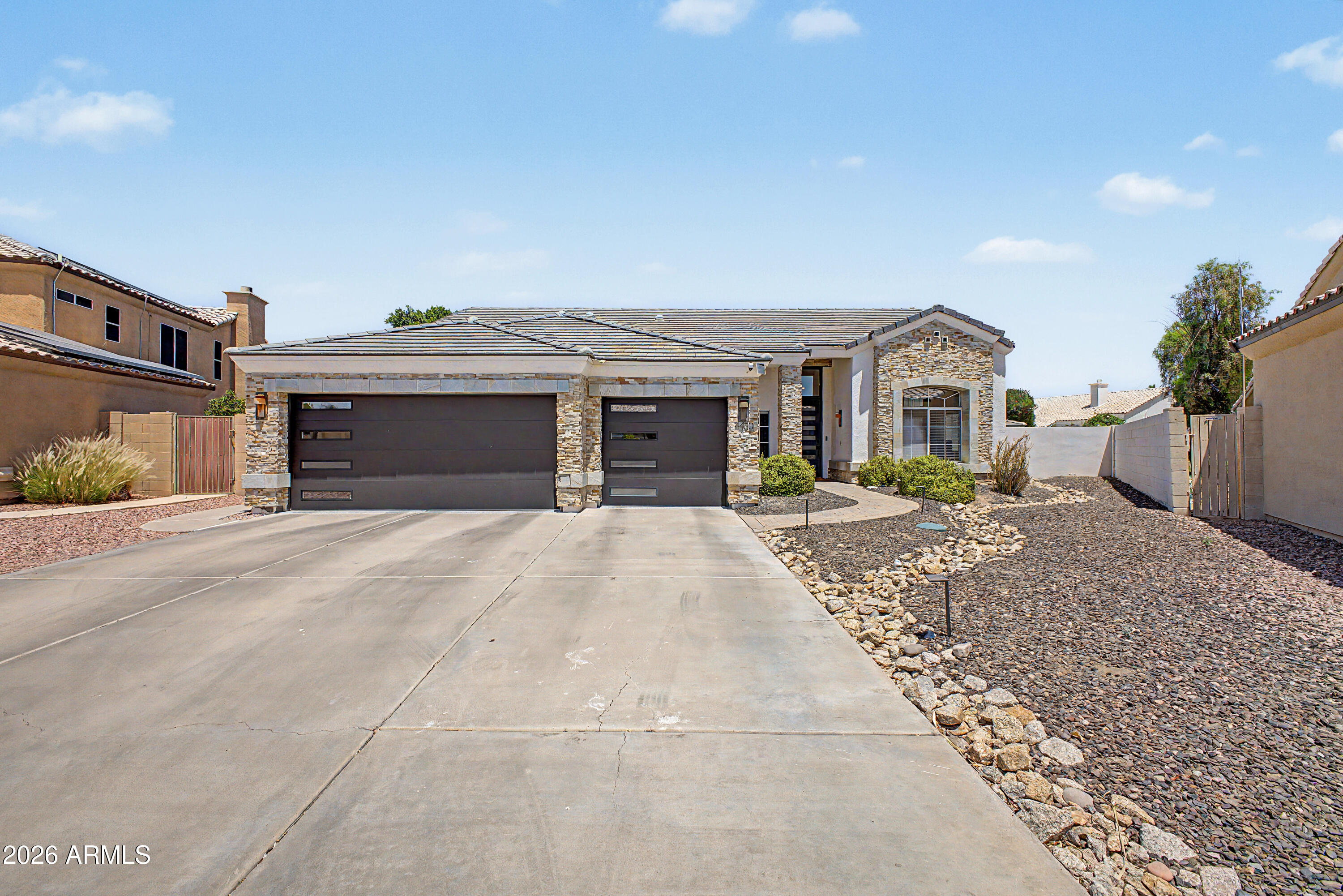 Luxury meets resort-style living in this stunning 4-bedroom, 2-bathroom home with a spacious 3-car garage. Repainted throughout, the interior offers a bright, modern aesthetic complemented by high-end finishes and thoughtful upgrades. The chef's kitchen features gorgeous granite countertops, custom cabinetry, a newer stove and dishwasher, and a built-in KitchenAid ice maker.


Step outside to an extraordinary backyard oasis designed for year-round enjoyment. Enjoy two sparkling pools, including a beach-entry PebbleTec pool and a separate heated lap lane, along with a relaxing spa, swim-up bar, and multiple spaces perfect for entertaining or unwinding in your own private retreat. Additional upgrades include epoxy-coated garage floors and a whole-home Kangen filtered water system. With exce