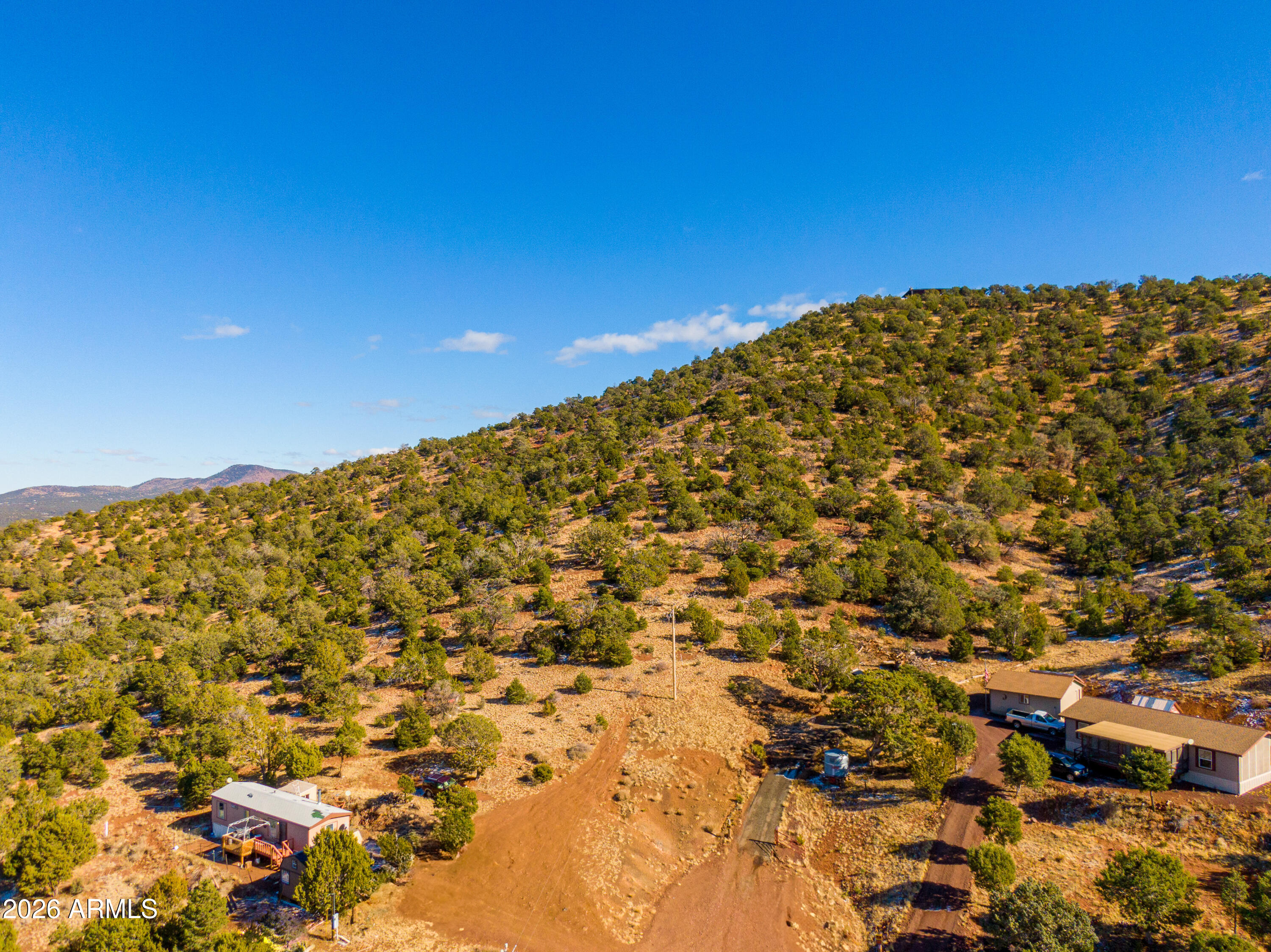 This gorgeous 9.55 acre lot is perfect for building your dream home! Located in the high desert of Williams off Highway 64, you'll have all you need to enjoy nature, watch the sun rise and set in peace, and create the home of your heart's desire. NO HOA! Electricity can be pulled from the road. Please be advised that in order to gain access to the property, about 50 feet of dirt needs to be graded from the legal access point up to the property line. Price reflects this necessity. Buyer to verify legal access with county.
