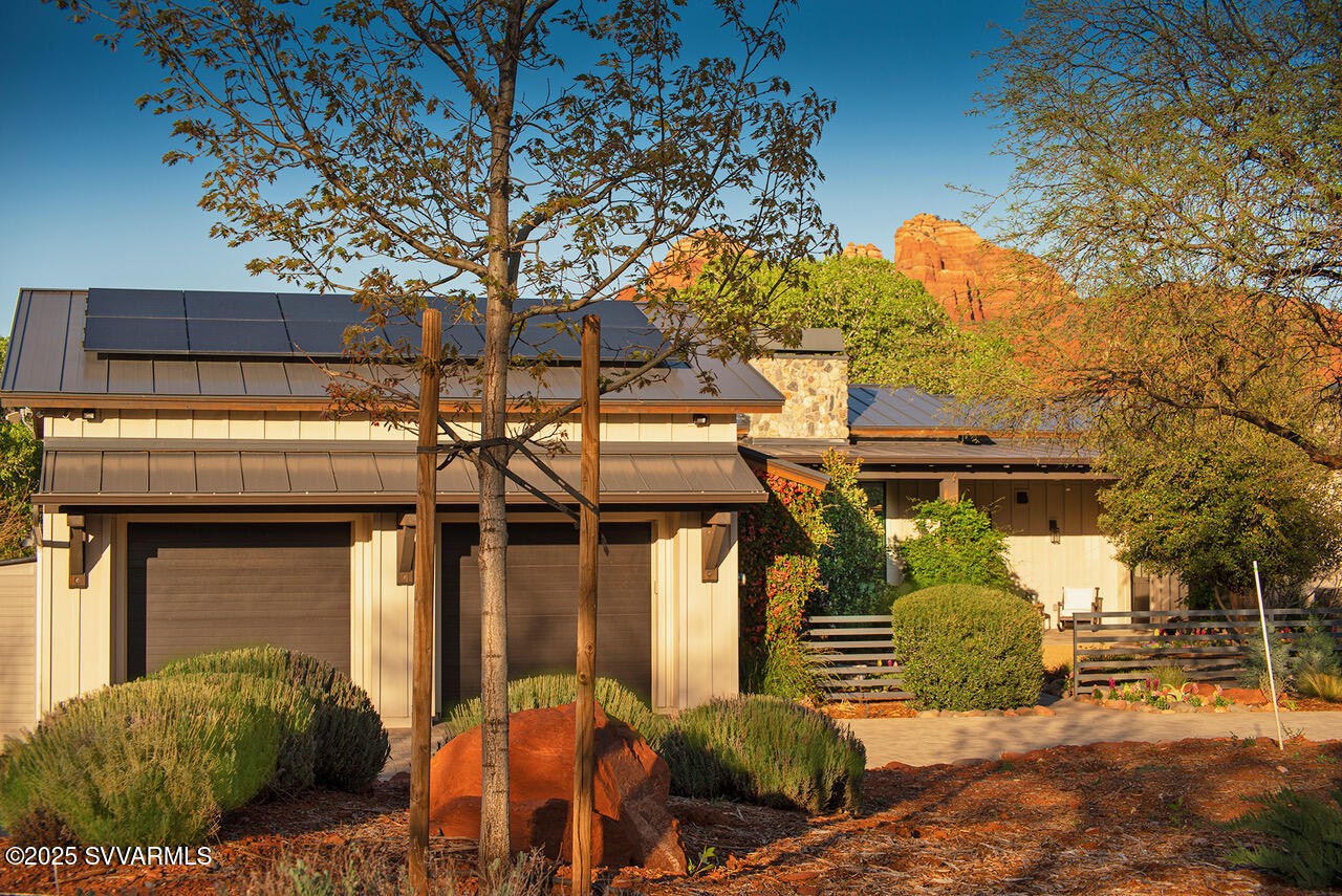 Experience refined living in Sedona Ranch's crown jewel - a luxurious modern farmhouse nestled on 2.5 wooded, WATERFRONT acres with 200 feet of frontage on Oak Creek. Built in 2019 with exquisite attention to every detail, this elegant retreat offers prominent RED ROCK VIEWS, unmatched privacy, and direct access to both 179 and SR 89A - unique to Sedona. The heart of the home is the open concept living, dining and gourmet kitchen, ideal for entertaining or simply enjoying the views. The resort-style primary suite is a true sanctuary, complete with a steam shower, freestanding tub, infrared sauna, and bespoke fitted closets. Tucked away near the creek is the 'Rabbit Hole' - an enchanting GUEST HOUSE offering guests a magical escape of their own. POND and  WATER FEATURE highlight the blissful experience.  Located behind the gates of Sedona Ranch of Oak Creek, this is more than just a home - it's the premiere lot in one of Sedona's most exclusive neighborhoods.

Some furnishings may convey.  View Amenities list in Documents tab.  Solar is owned.