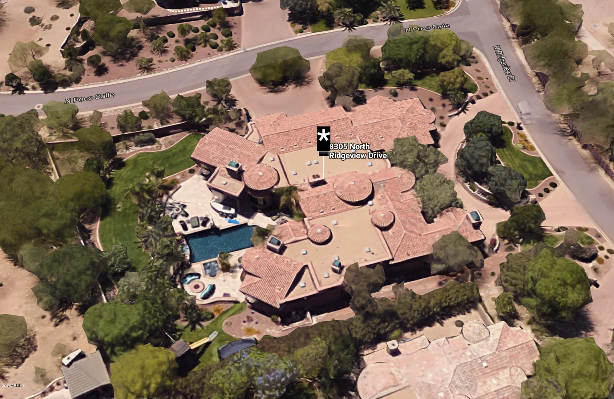 JUST REDUCED 250K! One-of-a-Kind 6 Bedroom Mediterranean Estate offers comfortable elegance with a perfect floorplan. Authentic materials such as Reclaimed Wood Floors, Venetian Plaster, Cantera Fireplaces and Hand-painted Frescos Lend Warmth and Drama. Acclaimed Interior Design by Feathers Creates Stunning Ambiance. Great Room with Wet Bar and Vanishing Wall of Glass Opens to Inspired Outdoor Living. Grecian Pool/Spa, Tiered Patios, Mummy Mtn Views & Palm Gardens Grace the Backyard. Stylish Entertaining awaits in Kitchen with impressive Custom Cabinets, Gorgeous Honed Granite. Master Suite Enjoys Sitting Room, Dressing Area and Custom Closets. Ideal 3 Bedroom Children's Wing Features Playroom/Computer Stations. Dramatic Guest Quarters or Second Full Master Suite. Stunning and Special.