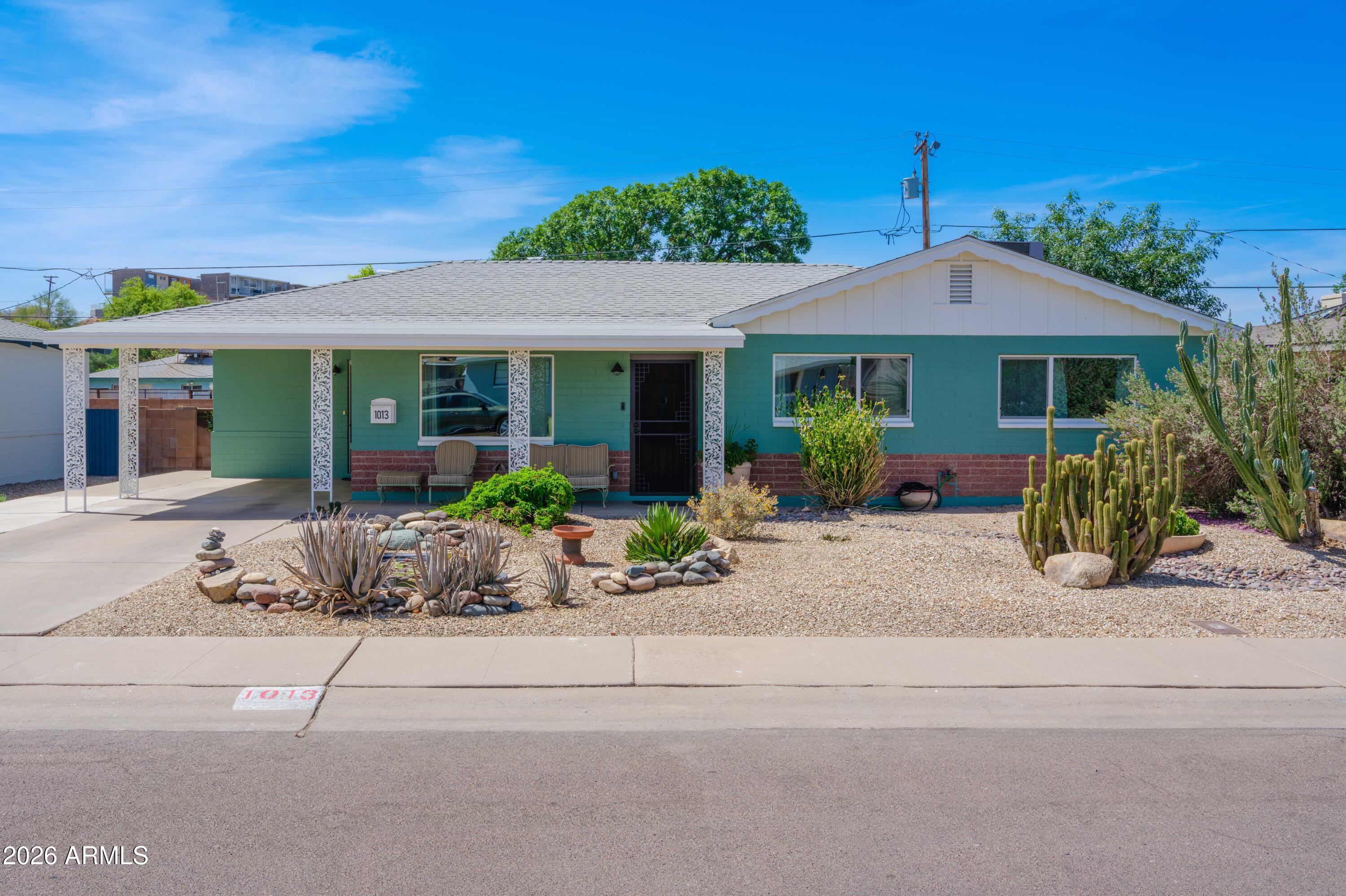 Expanded and beautifully updated mid-century masonry ranch in desirable New Northtown in N PHX! Move-in-ready 3 BR, 2 BA home w/1,790SF+- of thoughtfully designed space w/ oversized family rm, stained/sealed
concrete floors, updated baths. Custom chef's kitchen: bamboo cabinetry, solid-surface counters, farm sink, sit-up island, B/I pantry, gas cooktop, double ovens. Spacious primary suite includes updated bath w/custom
glass tile shower. Major upgrades include dual-pane windows, tankless gas water heater, water softener, whole-house water treatment, air purification, updated sewer line. Enjoy mountain views, mature landscaping, grapevines, garden beds, custom steel-covered patio,
storage shed and exceptional privacy. Close to dining, canal paths, hiking, biking, Sunnyslope HS too! WOW! Nestled in the iconic New Northtown neighborhood of North Central Phoenix, this lovingly preserved and thoughtfully expanded Staggs-Bilt ranch home is a rare opportunity to own an authentic piece of Arizona's mid-century heritage. Developed during an era when Ralph Staggs was creating some of the Valley's most admired masonry homes, New Northtown represented desert living at its best, with thoughtfully planned streets, mountain views, and quality construction. With nearly 1,800 square feet of living space, an expanded floorplan, and carefully curated updates throughout, this residence seamlessly blends classic architecture with contemporary comfort.
Owned and meticulously maintained by the same family for the past 28 years, every improvement reflects genuine pride of ownership and thoughtful stewardship rather than a quick remodel. Inside, stained and sealed concrete floors anchor the main living spaces and Primary Suite, while engineered wood flooring warms 2 of the bedrooms. The spacious family room flows effortlessly into a remarkable custom kitchen designed for both serious cooking and entertaining. Bamboo cabinetry, a generous sit-up island, solid-surface counters, a farmhouse sink, built-in pantry, KitchenAid five-burner gas cooktop with double ovens. Bosch dishwasher, and an Italian-crafted range hood create a culinary space that rivals many luxury homes at a far higher price point.
The private primary suite offers a beautifully updated bath with a custom glass shower enclosure, while the secondary bath features full-height tile surrounds and quality finishes. Beyond the aesthetics, the home has been extensively upgraded with modern systems including double-pane windows, a tankless gas water heater, whole-house water treatment, water softener, maintained HVAC systems with Purifi air filtration, and a recently replaced sewer line. The result is a residence that is as functional and efficient as it is beautiful.
Outdoors, the property truly shines. The lush backyard is a gardener's paradise with mature trees, planting beds, grapevines, mountain views, and multiple areas to relax or entertain. A custom steel-covered patio creates an unforgettable outdoor living room complete with cooling fan and year-round comfort, while a substantial storage shed provides ample space for gardening tools, bicycles, and hobbies. Ideally situated within the sought-after Sunnyslope High School boundary and moments from some of Phoenix's favorite local destinations--including Little Miss BBQ, The Vig, OHSO, Luci's, and miles of canal-side biking and hiking trails--this exceptional home captures the very best of North Central Phoenix living.
FEATURES
" Expanded 1,797-square-foot Staggs-Bilt masonry ranch home
" Three bedrooms and two updated baths
" Custom expanded chef's kitchen with oversized island bar
" Bamboo cabinetry with built-in pantry system
" Solid-surface concrete-style countertops and farmhouse sink
" KitchenAid five-burner gas cooktop W/ double ovens
" Stained and sealed concrete flooring in main living and Primary Suite
" Engineered wood flooring in guest bedrooms
" Primary suite with updated bath and custom glass shower enclosure
" Double-pane windows throughout for energy efficiency
" Tankless gas water heater
" Whole-house water treatment, water softener
" Custom steel-covered patio,
" Mature landscape, grapevines, mountain views, and storage shed